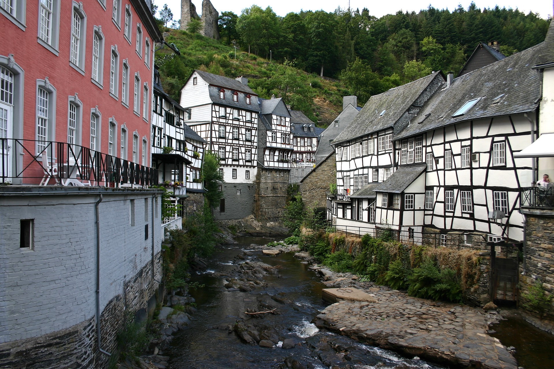 Half-timbered houses along a river in Germany HD Wallpaper