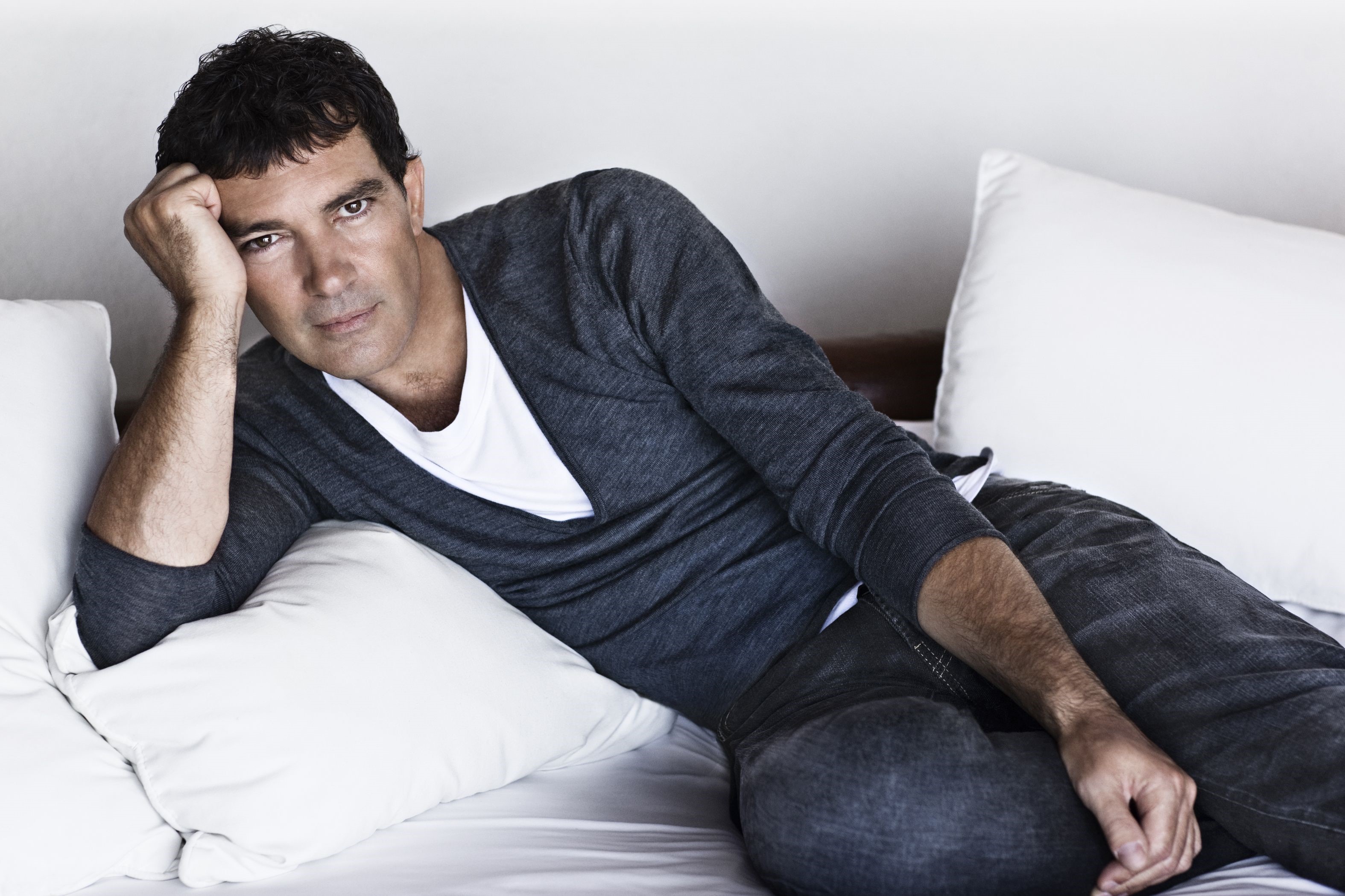 Antonio Banderas lying on a bed HD Wallpaper