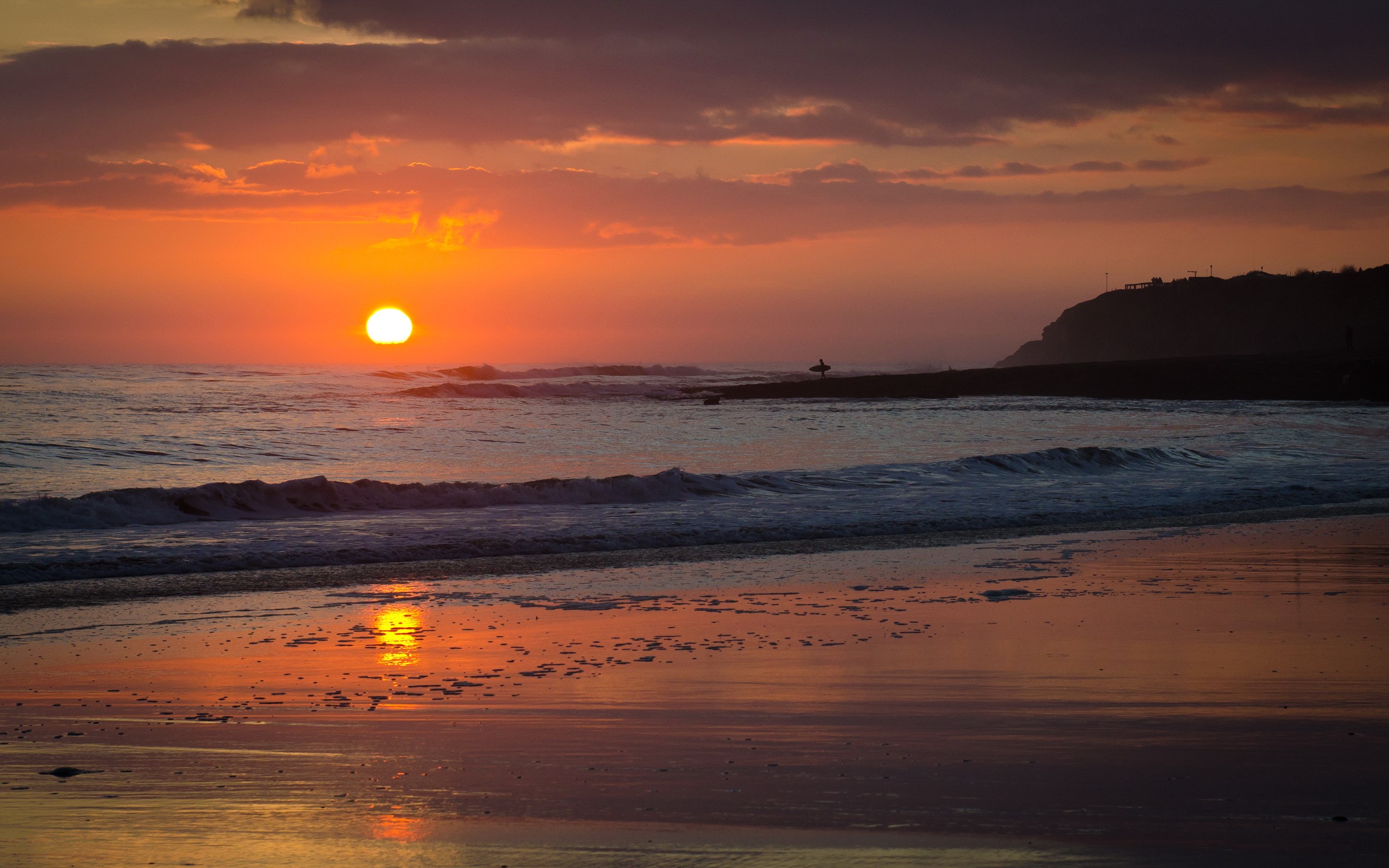 Sunset over the ocean with a surfer HD Wallpaper