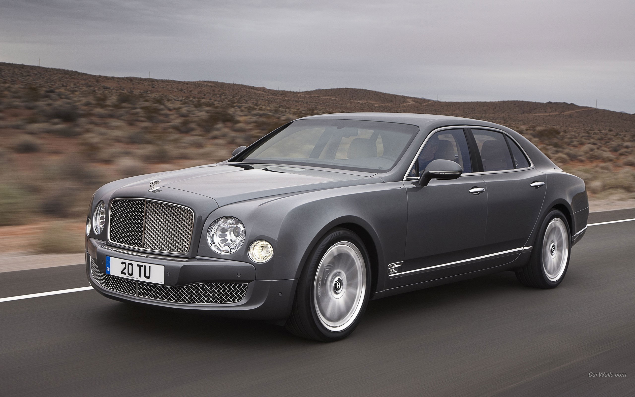 Bentley Mulsanne driving on a road HD Wallpaper