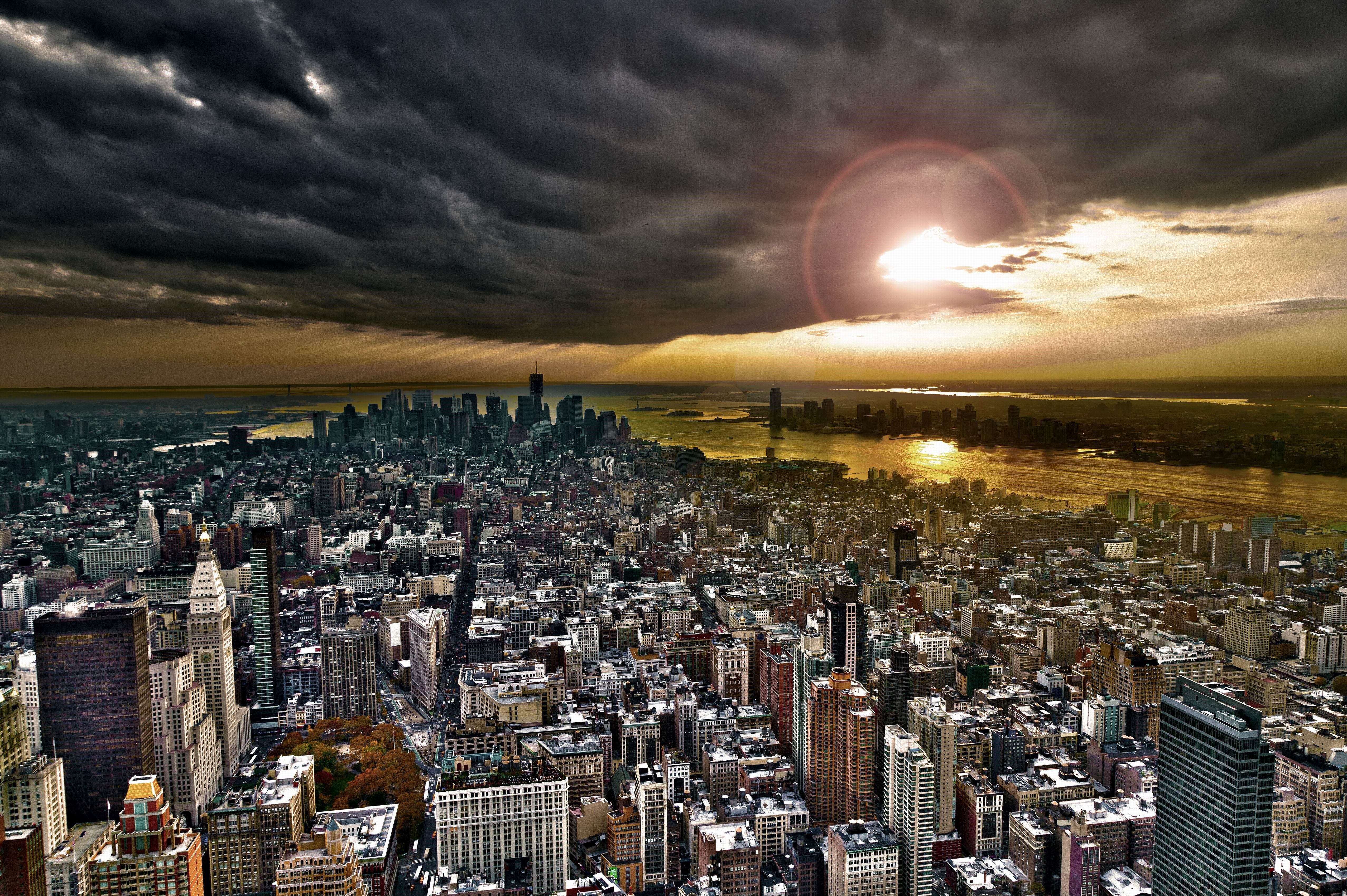 New York City Skyline at Sunset with Stormy Clouds HD Wallpaper