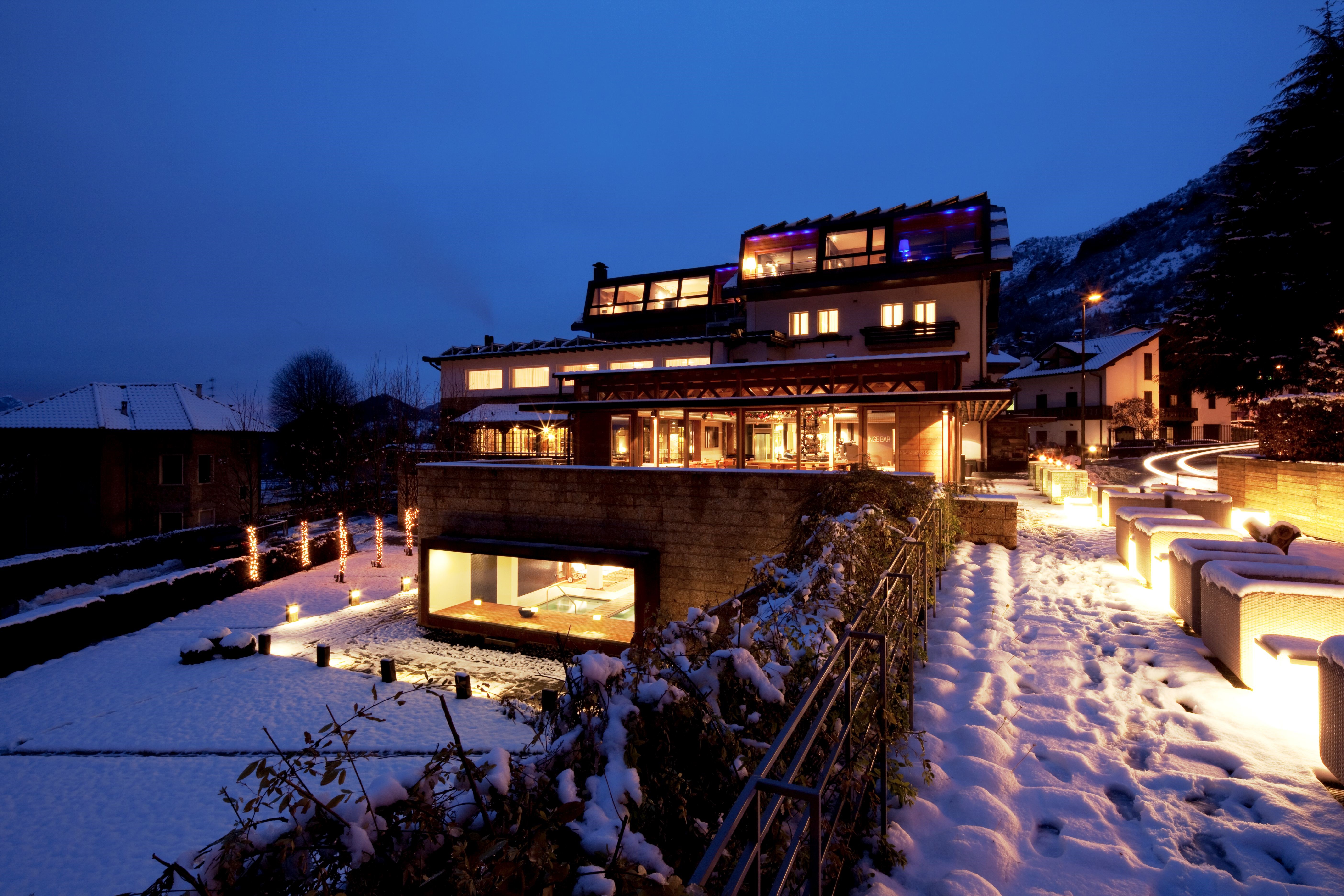 Modern hotel building in snowy Italy at dusk HD Wallpaper