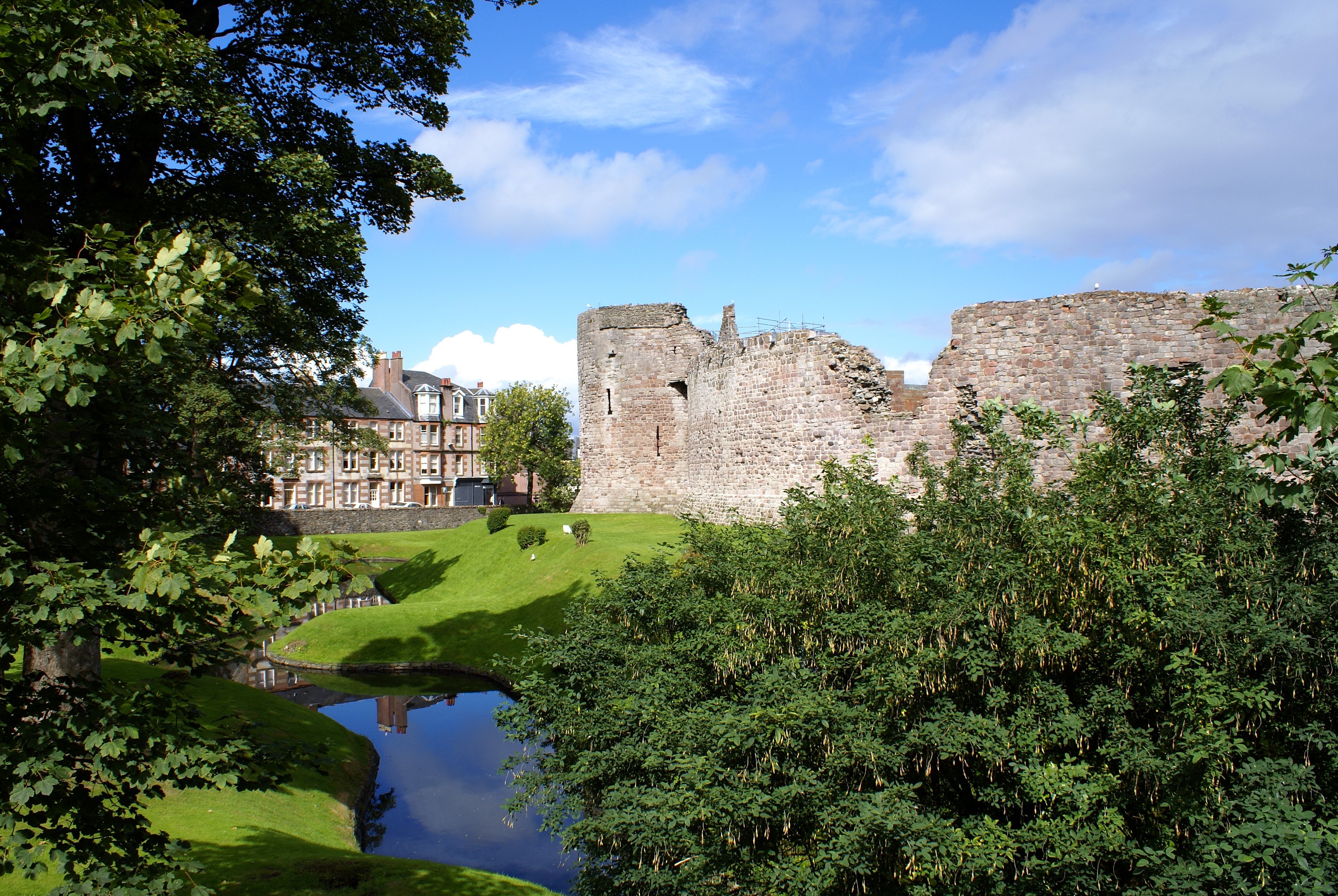 Rothesay Castle ruins with a moat and buildings HD Wallpaper