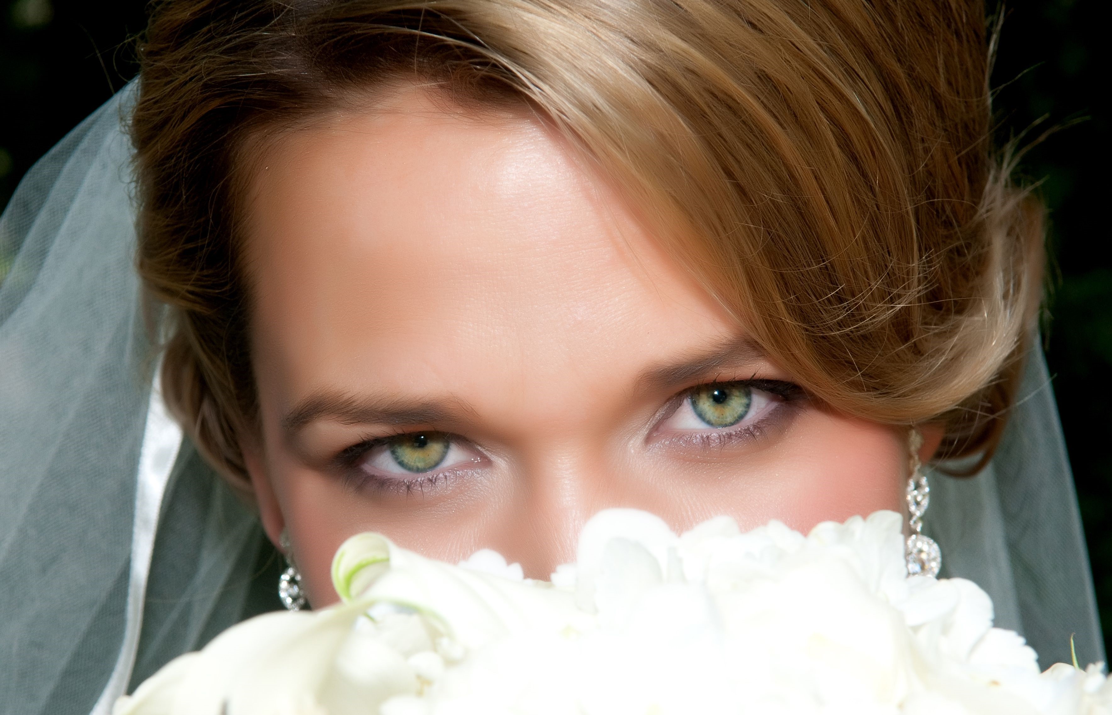 Bride's Eyes Behind Bouquet HD Wallpaper