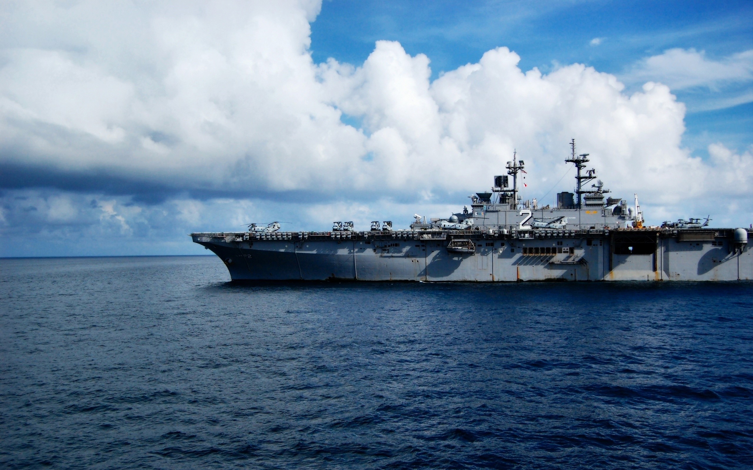 Amphibious assault ship sailing on the ocean HD Wallpaper