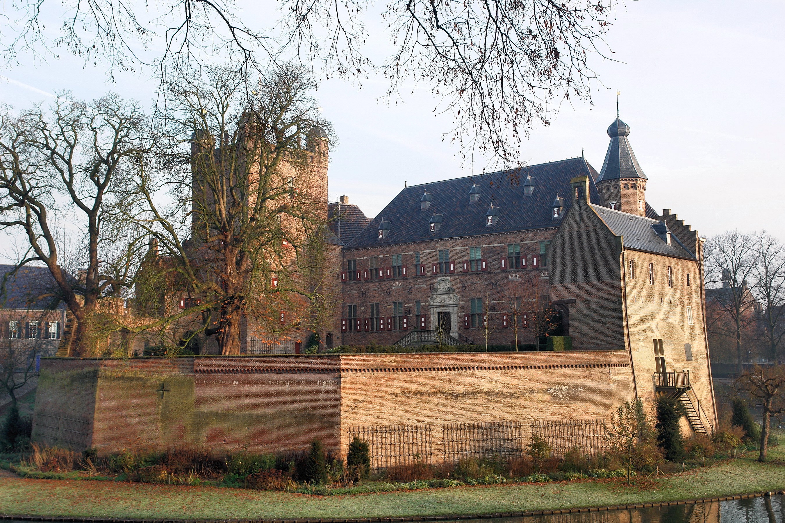 Castle with moat and trees HD Wallpaper