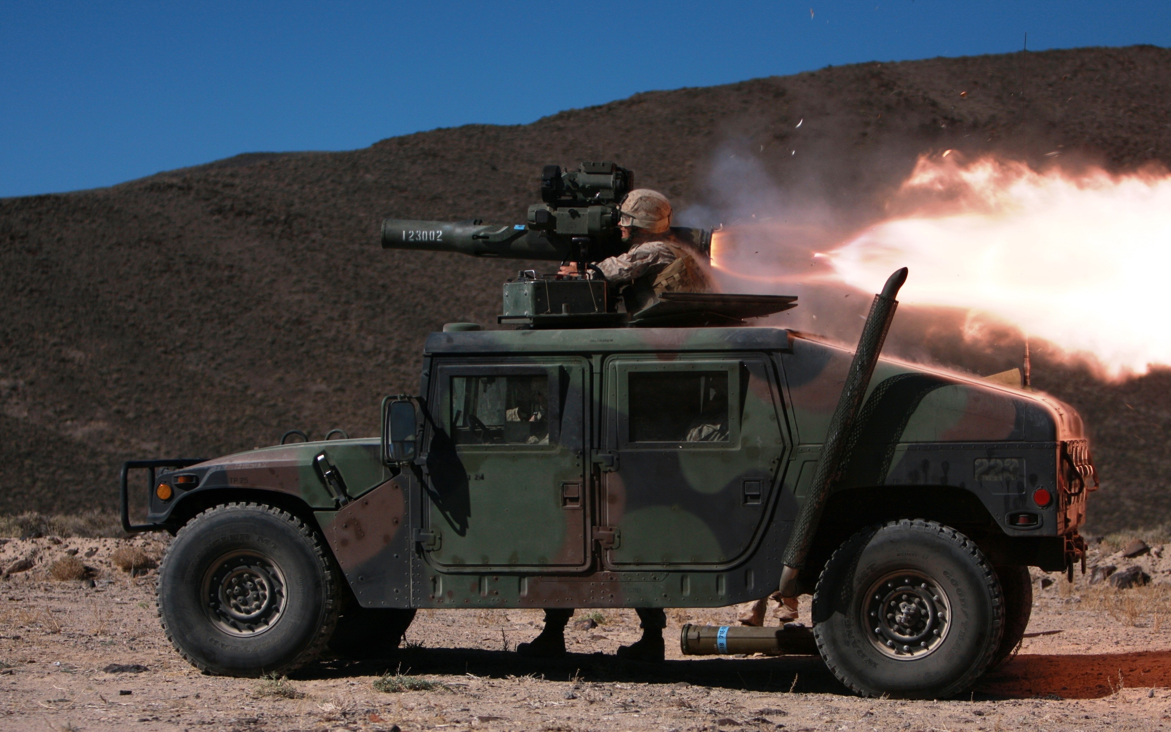 Military vehicle firing a missile HD Wallpaper