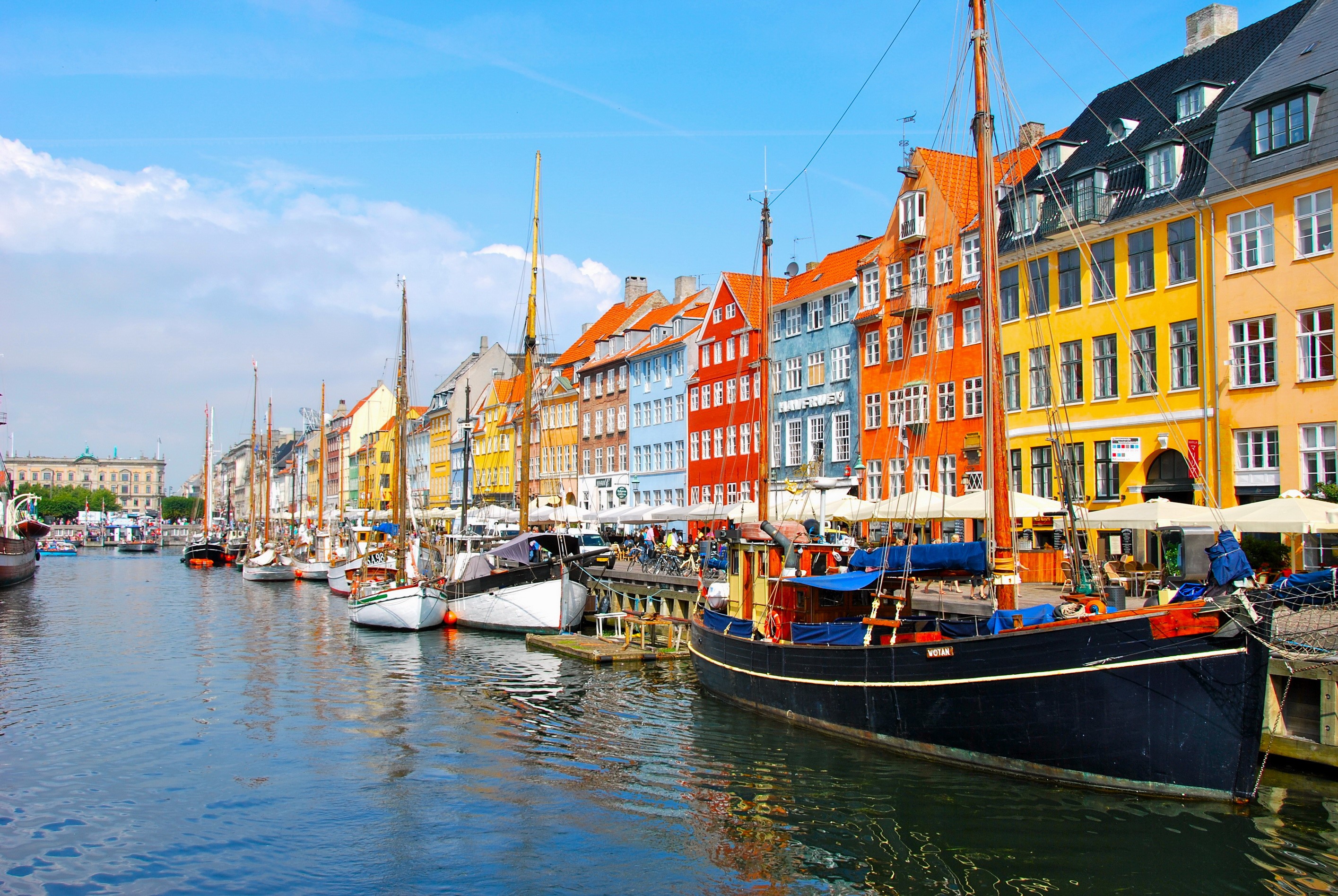 Nyhavn canal with colorful buildings and boats in Copenhagen, Denmark HD Wallpaper