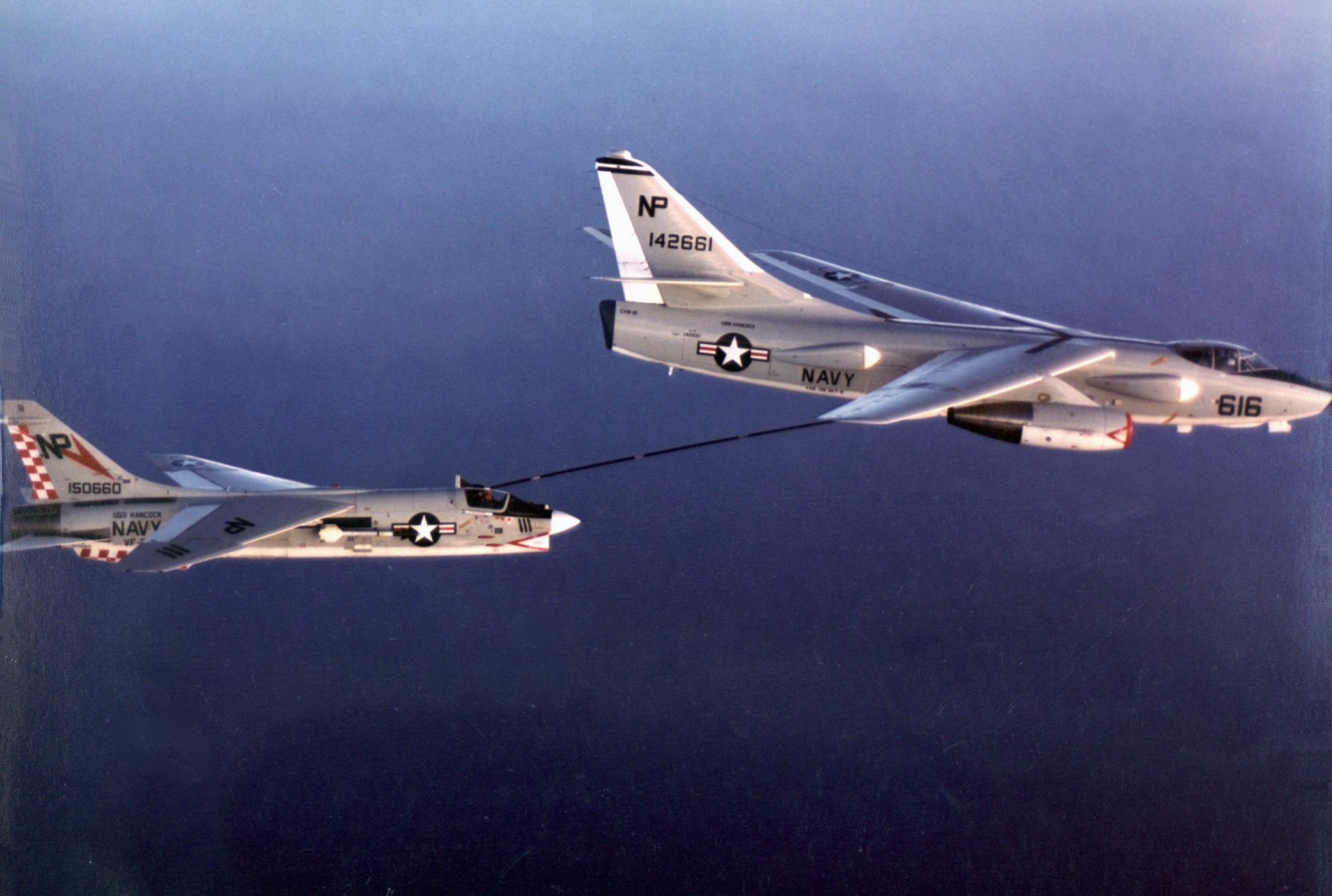 Two Douglas A-3 Skywarriors refueling mid-air HD Wallpaper