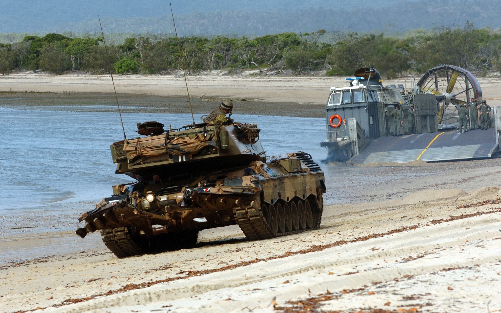 Tanks on a beach with a hovercraft landing craft HD Wallpaper