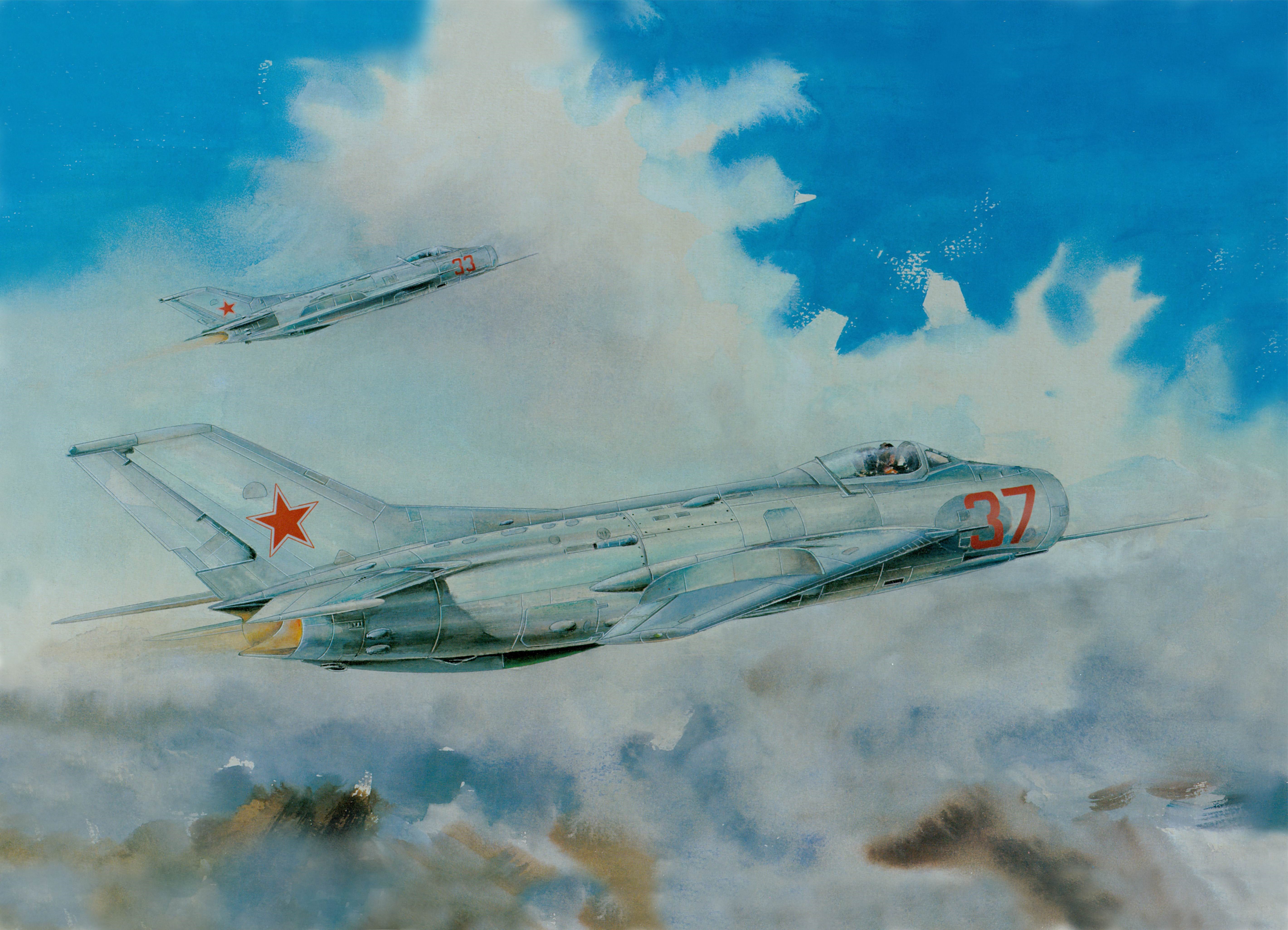 Two Soviet MiG-17 fighter jets flying through clouds HD Wallpaper