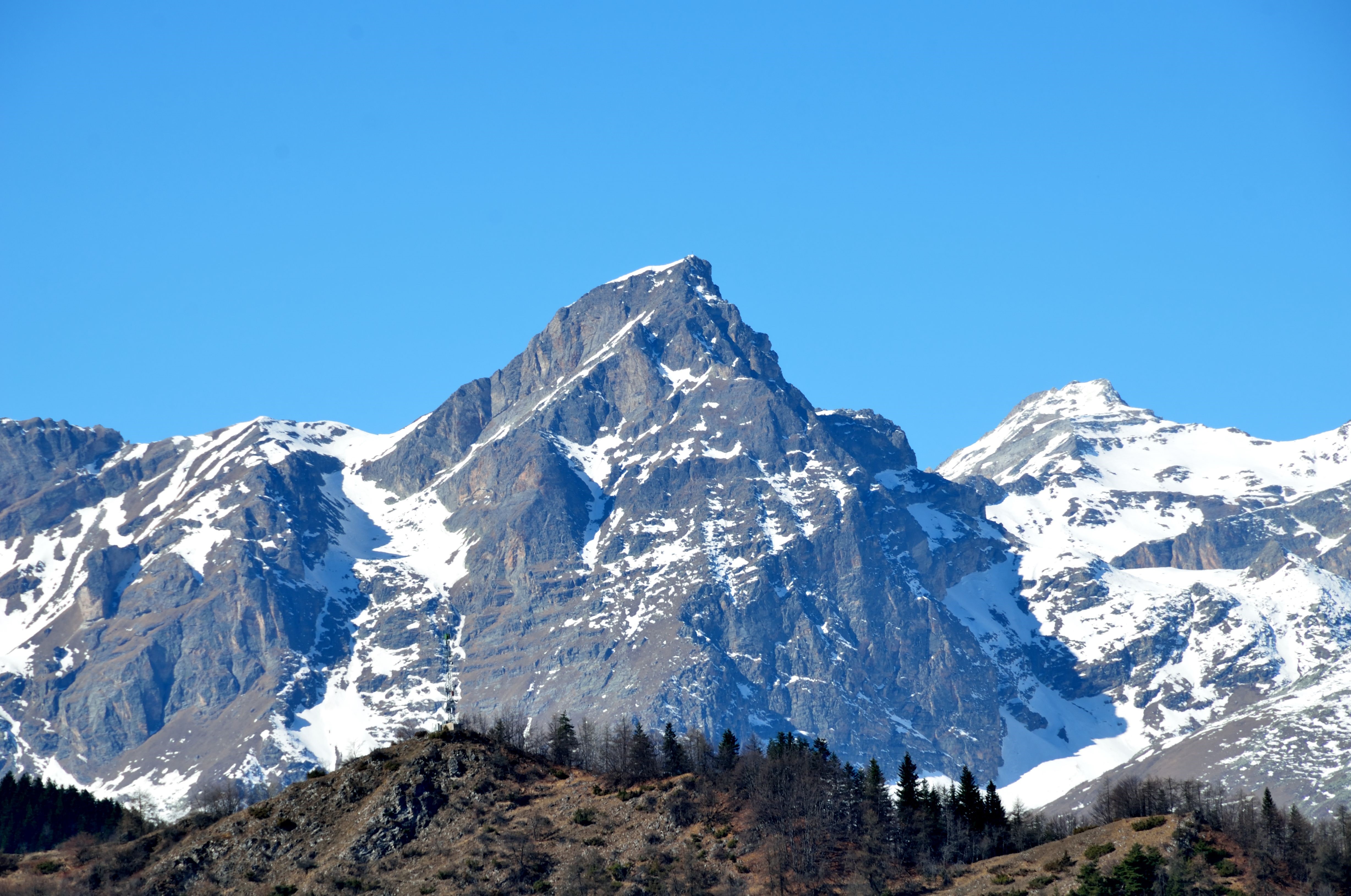 Snow-capped mountains under a clear blue sky HD Wallpaper