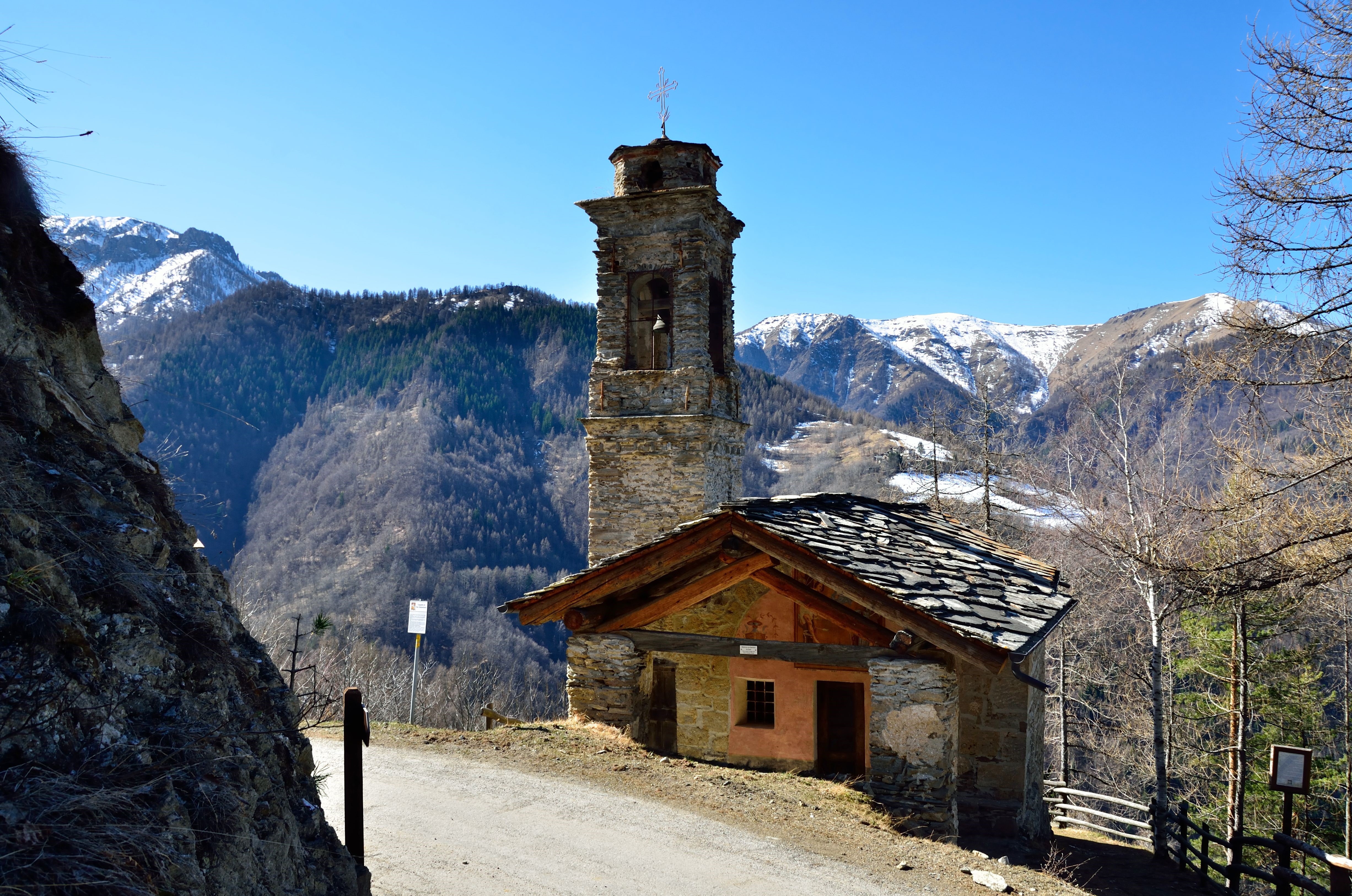 Stone church with bell tower in Italian Alps HD Wallpaper