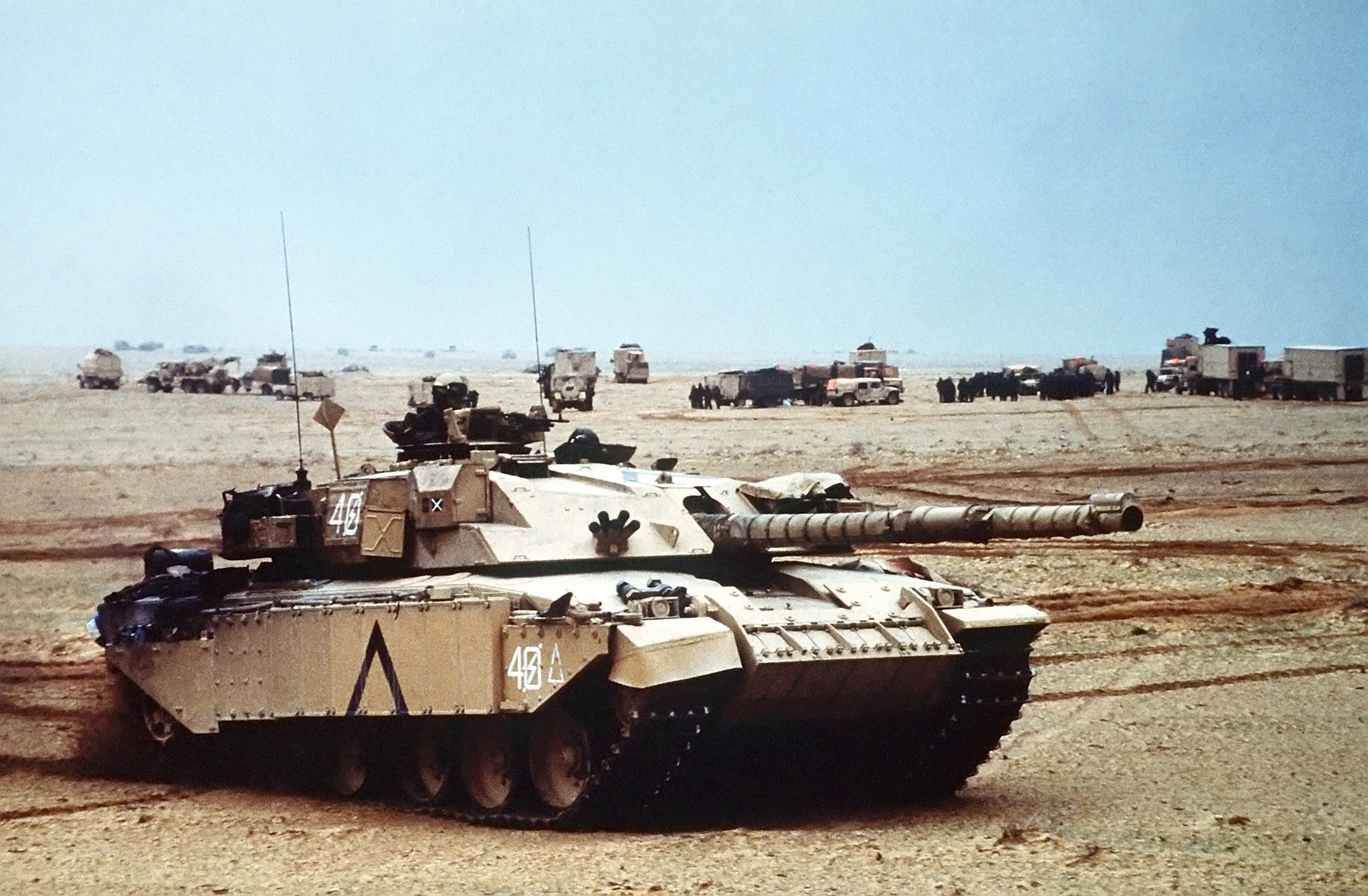 Challenger 2 tanks and support vehicles in desert HD Wallpaper