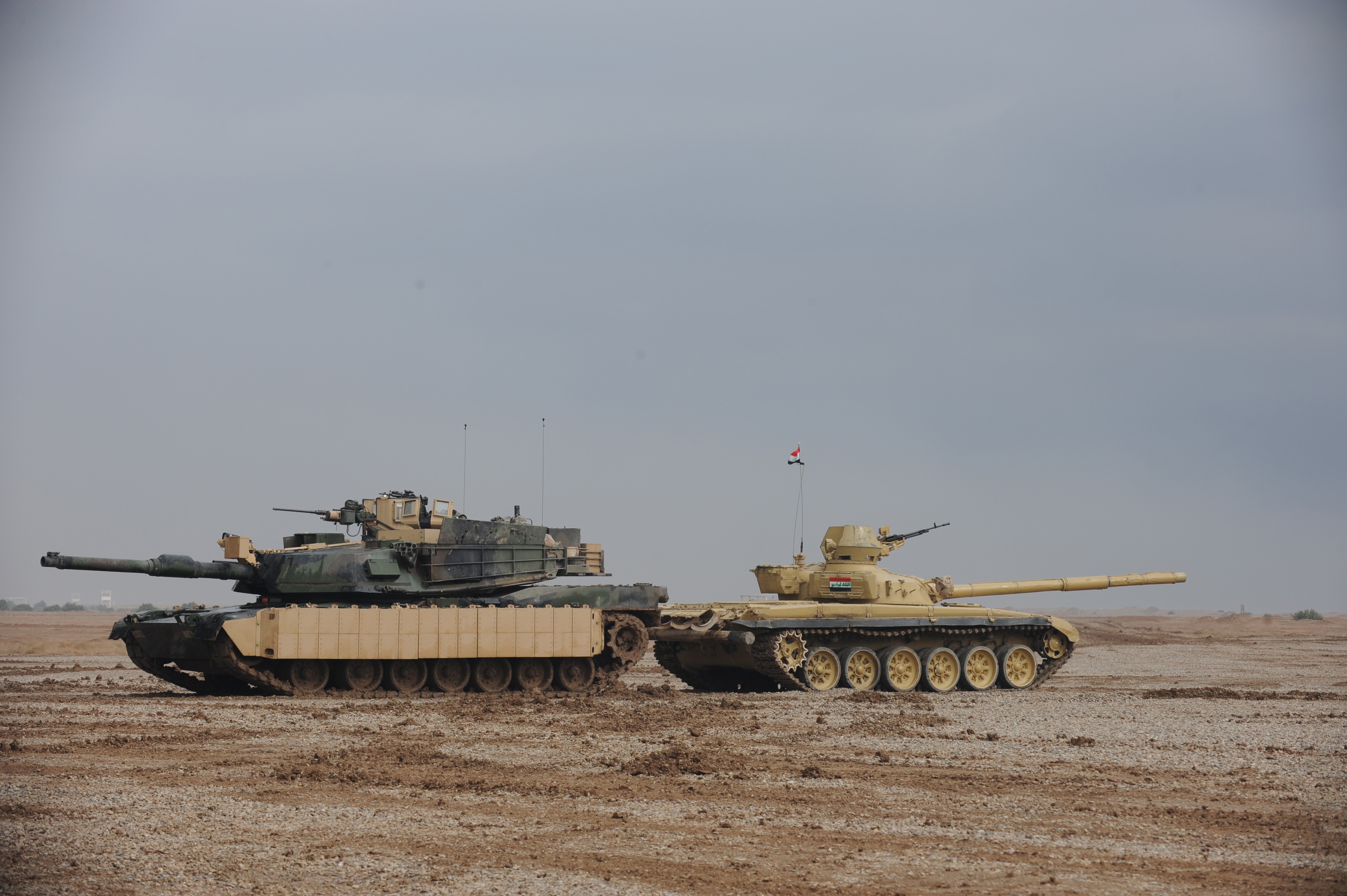 Two tanks in a desert landscape HD Wallpaper