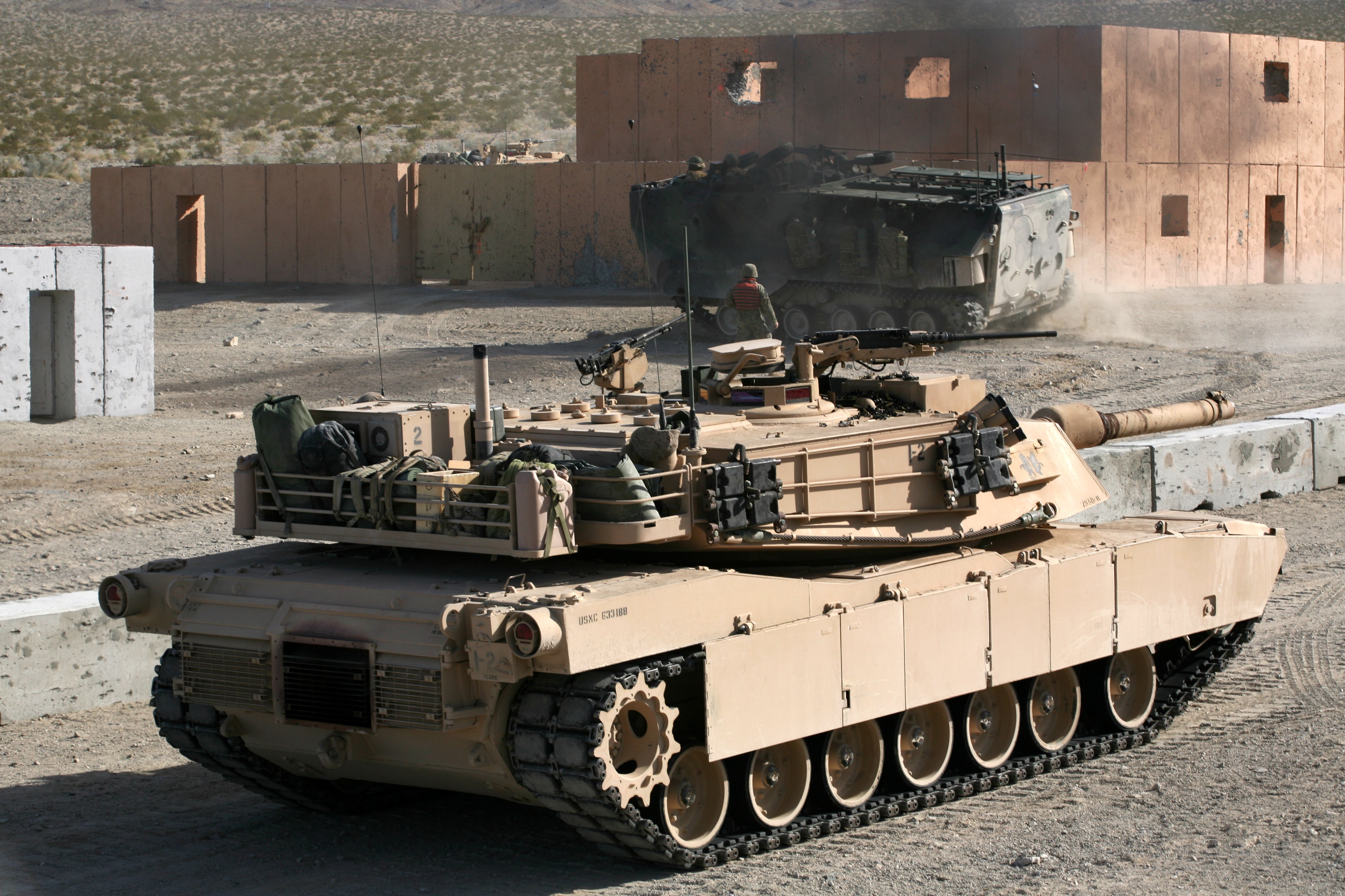 Tanks in a desert training area HD Wallpaper
