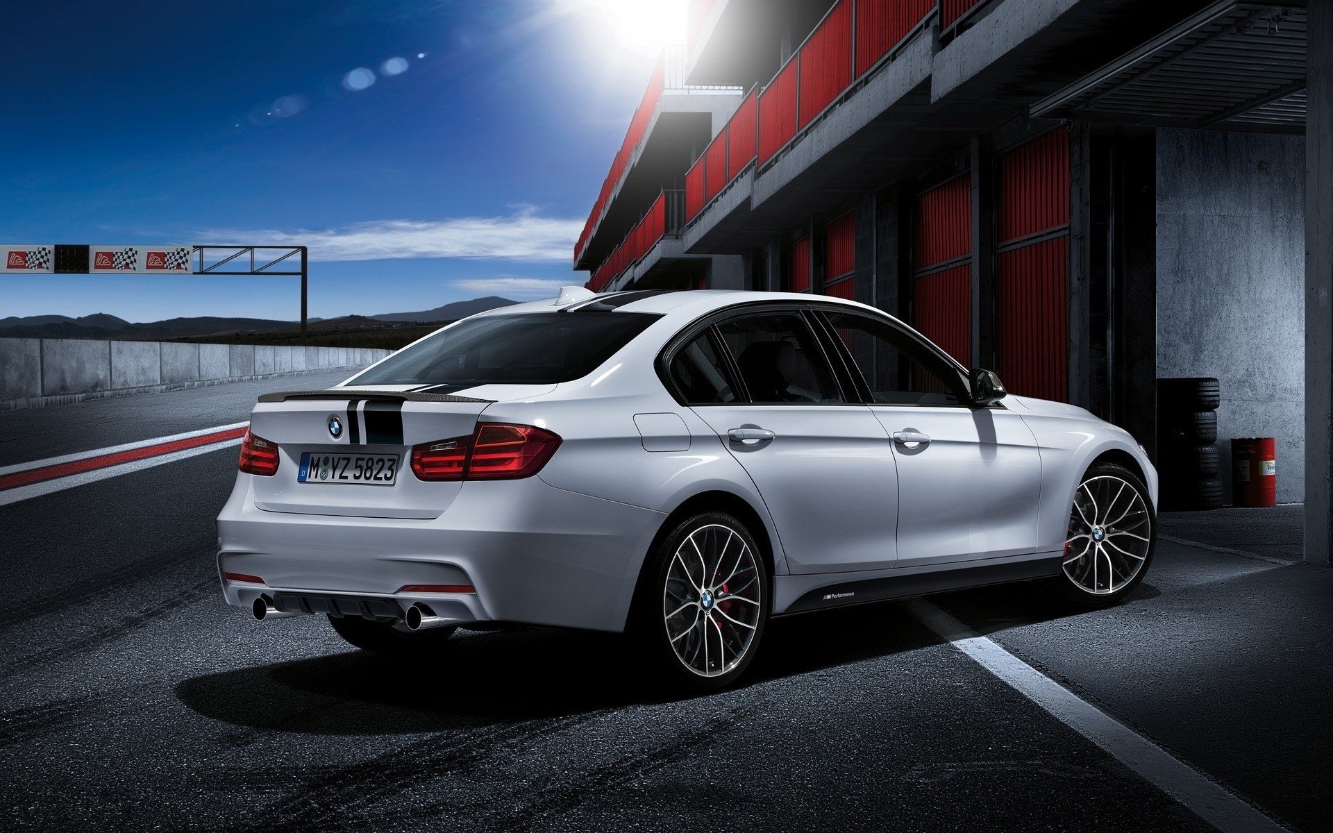 White BMW M Performance Sedan on Race Track HD Wallpaper