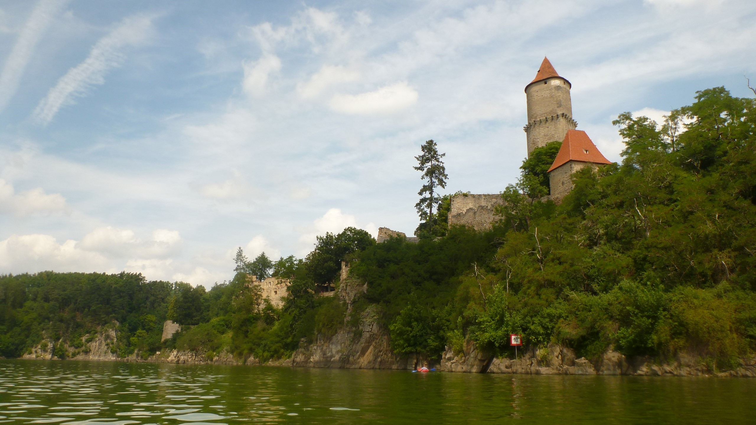 Castle ruins on a cliff overlooking a lake HD Wallpaper