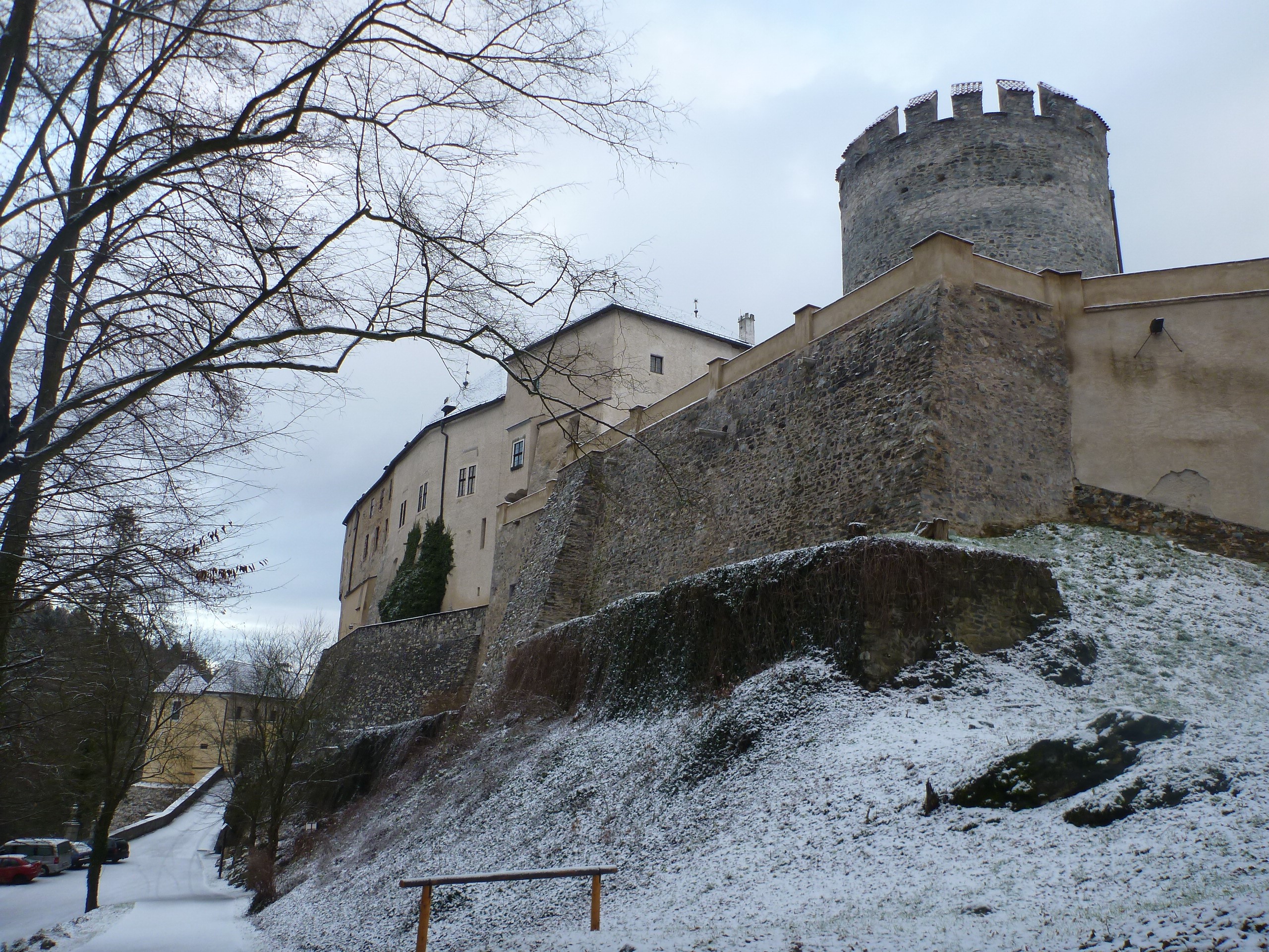 Castle on a snowy hill with bare trees HD Wallpaper