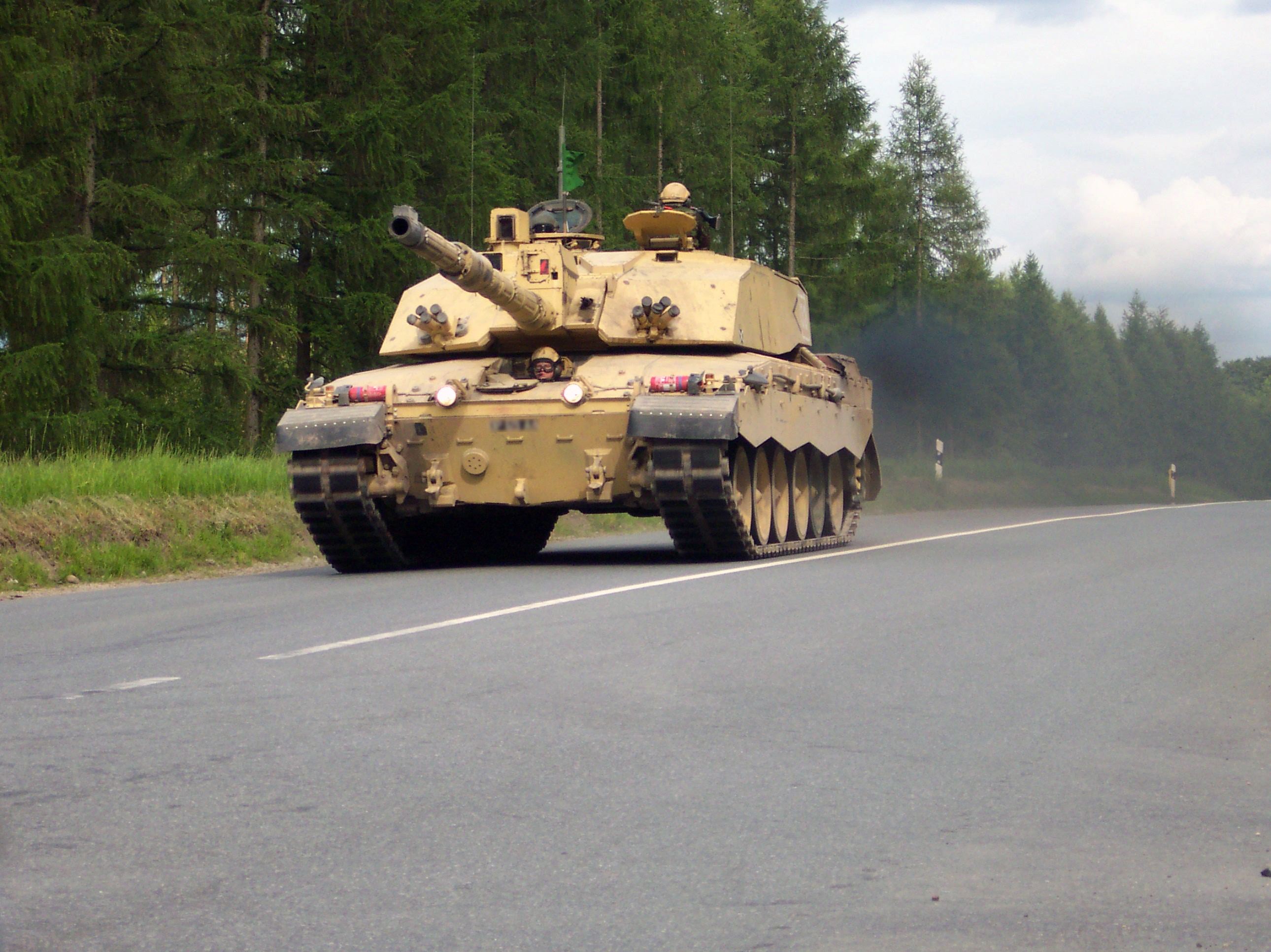 Challenger 2 tank driving on a road HD Wallpaper