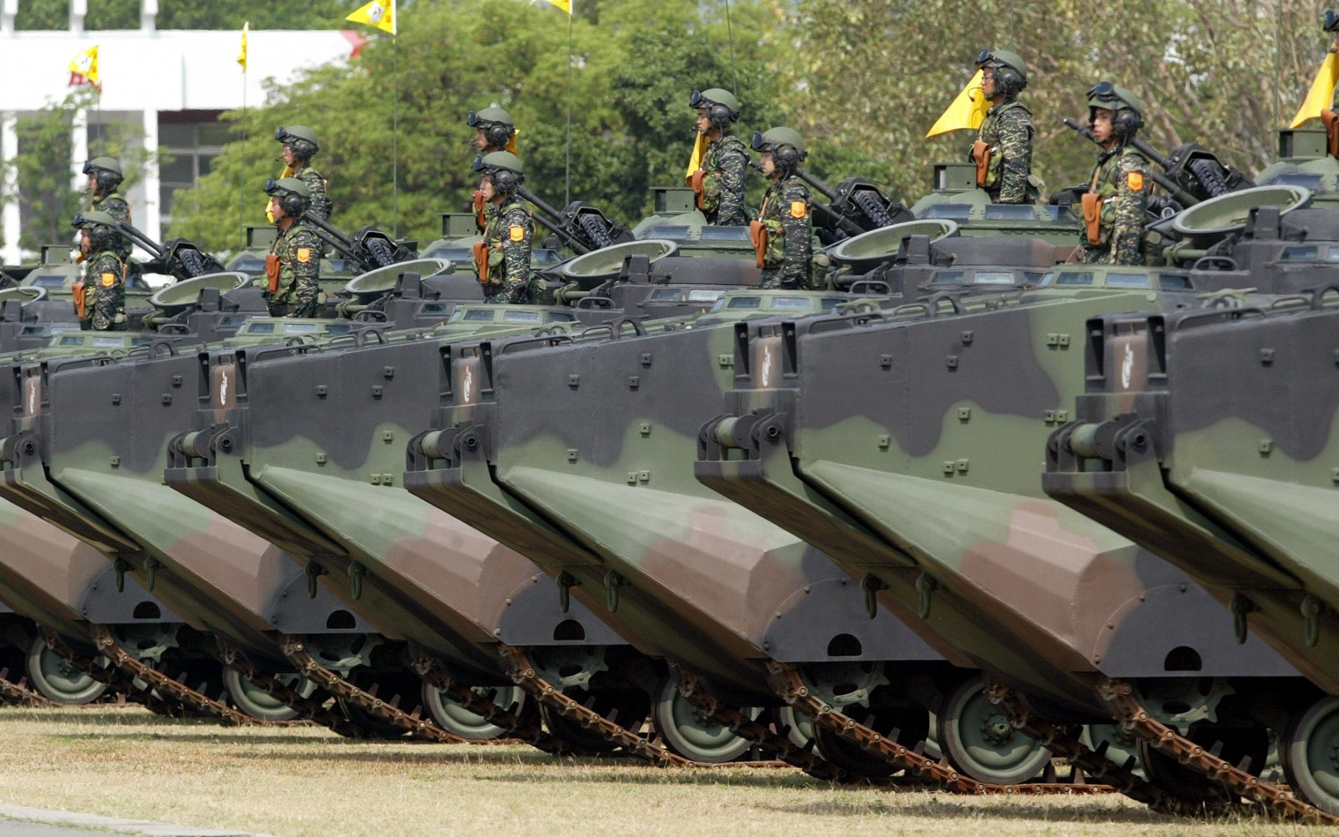 Soldiers in armored vehicles in a parade HD Wallpaper