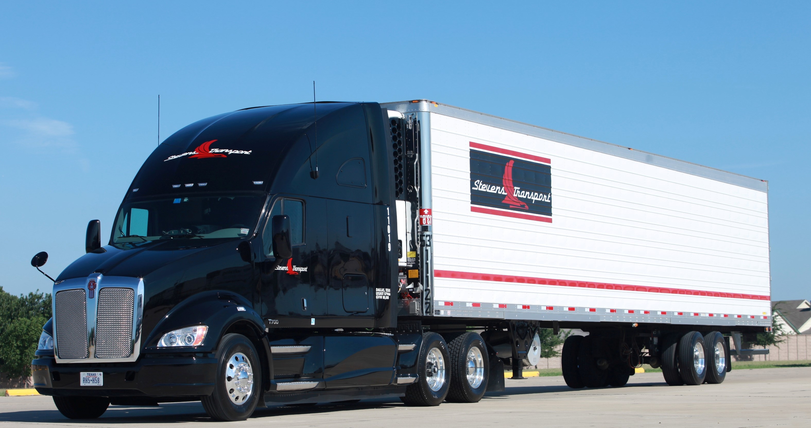 Black Kenworth Semi-Truck with Stevens Transport Trailer HD Wallpaper