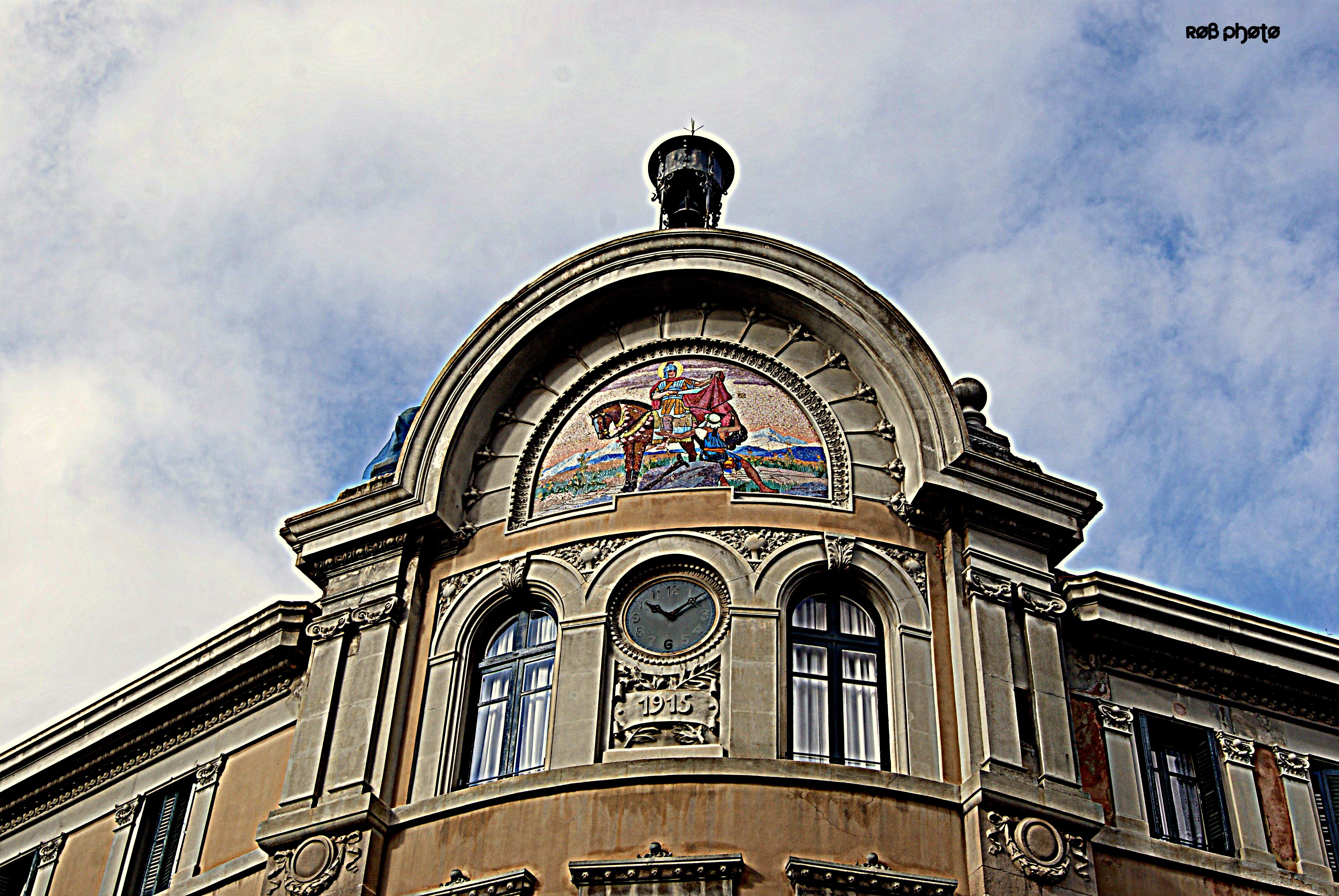 Building facade with mosaic and clock HD Wallpaper