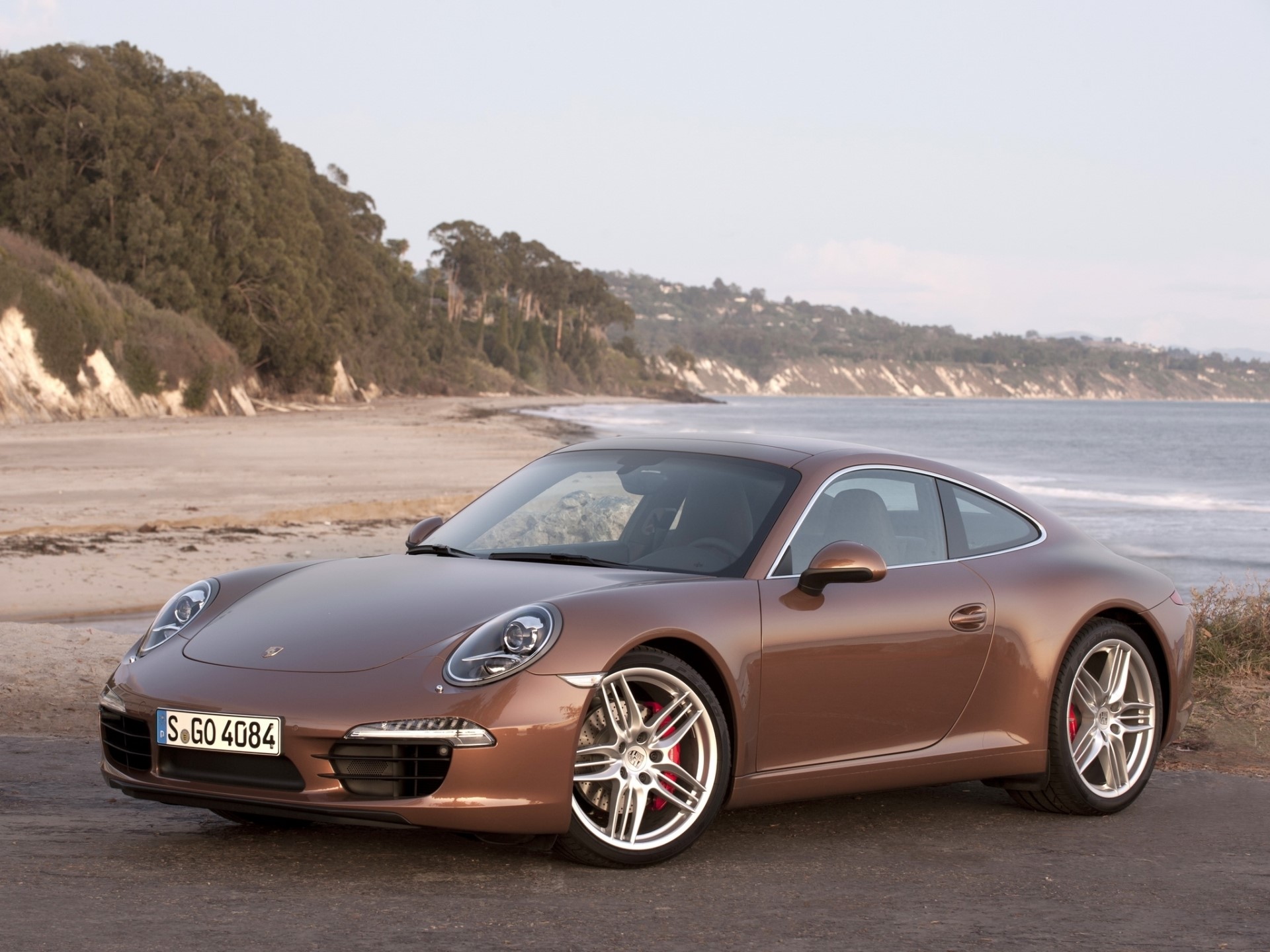 Porsche 911 Carrera parked on a beach road HD Wallpaper