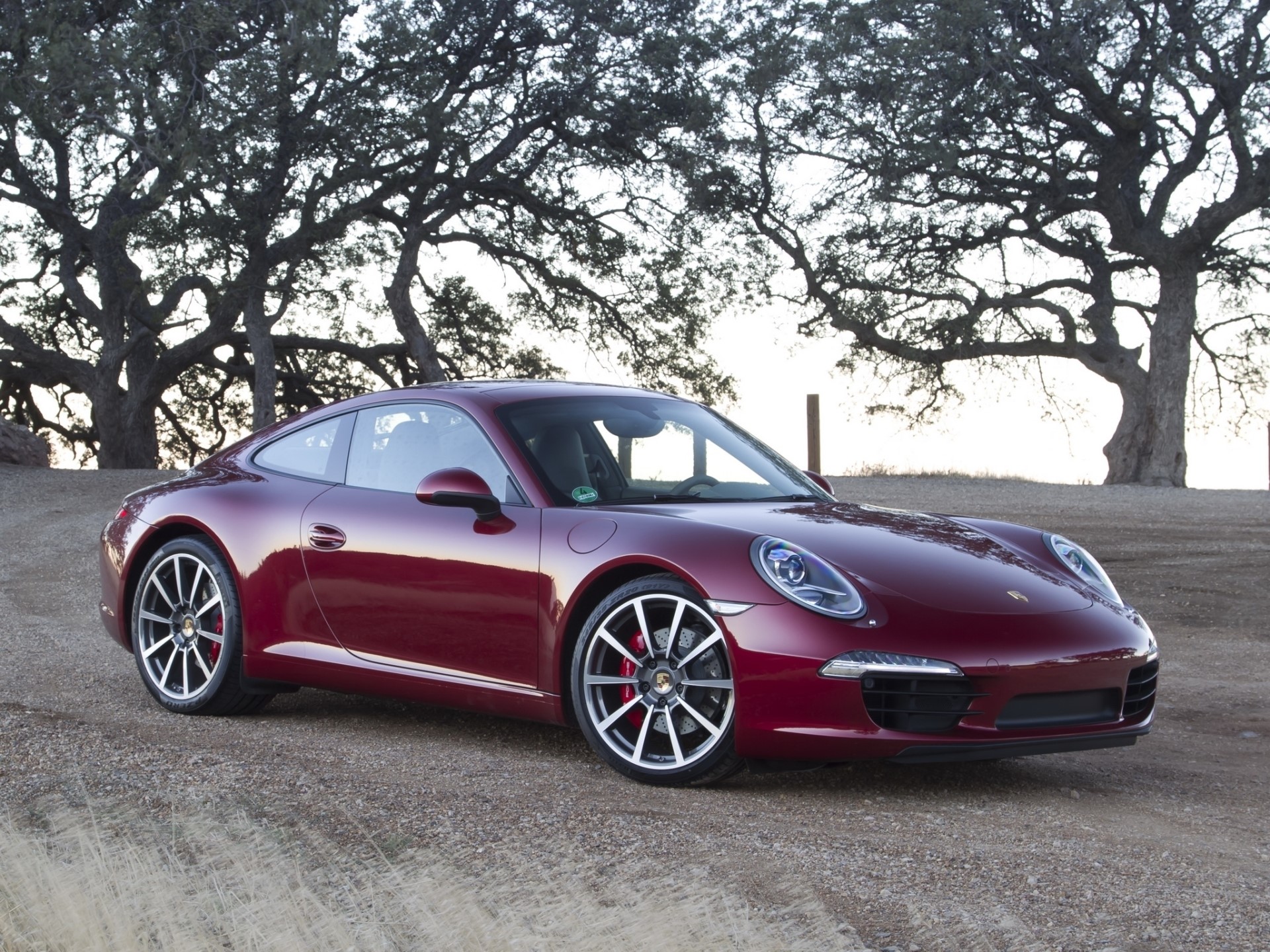 Red Porsche 911 parked on a dirt road HD Wallpaper
