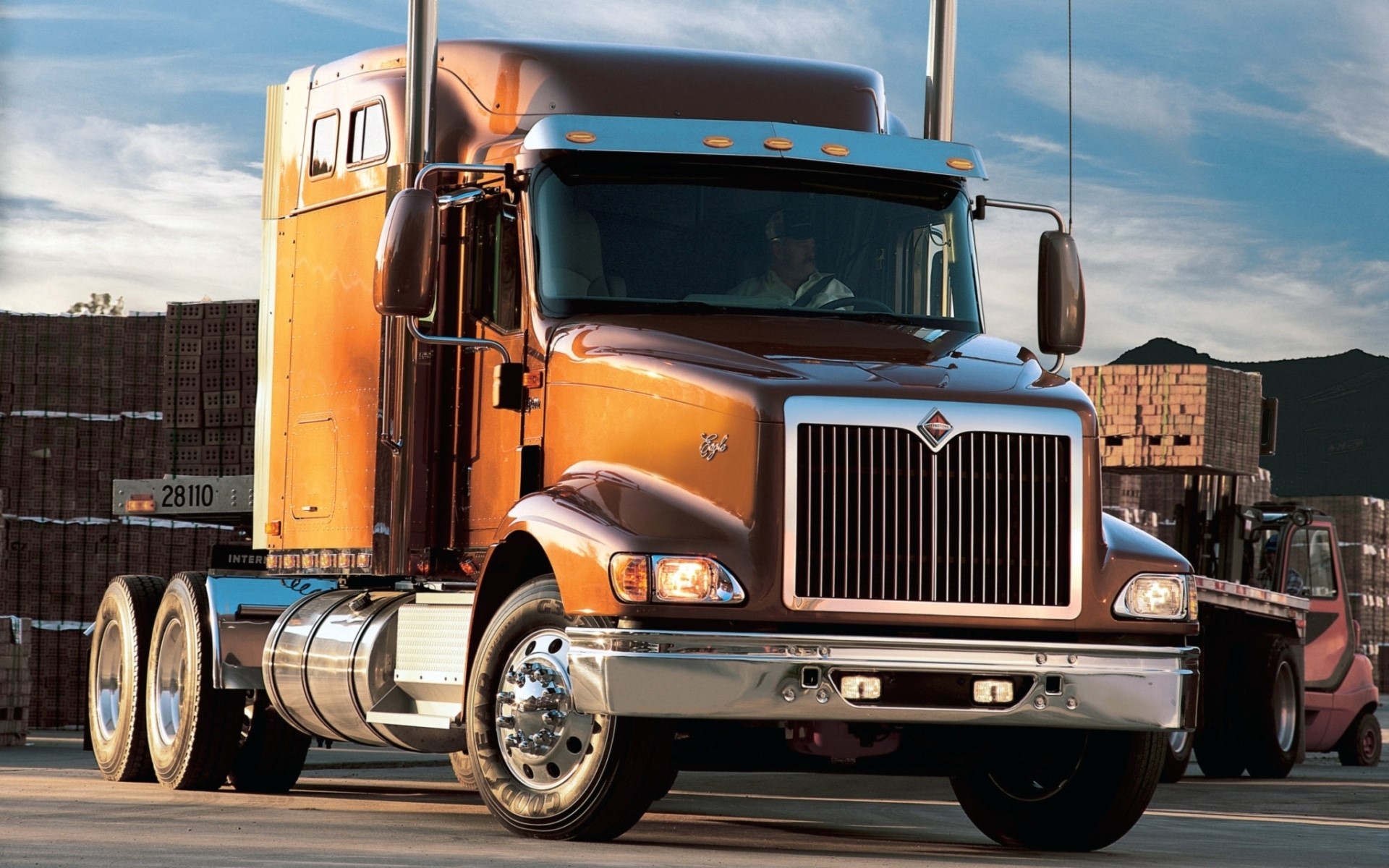 Brown International Semi-Truck parked outdoors HD Wallpaper