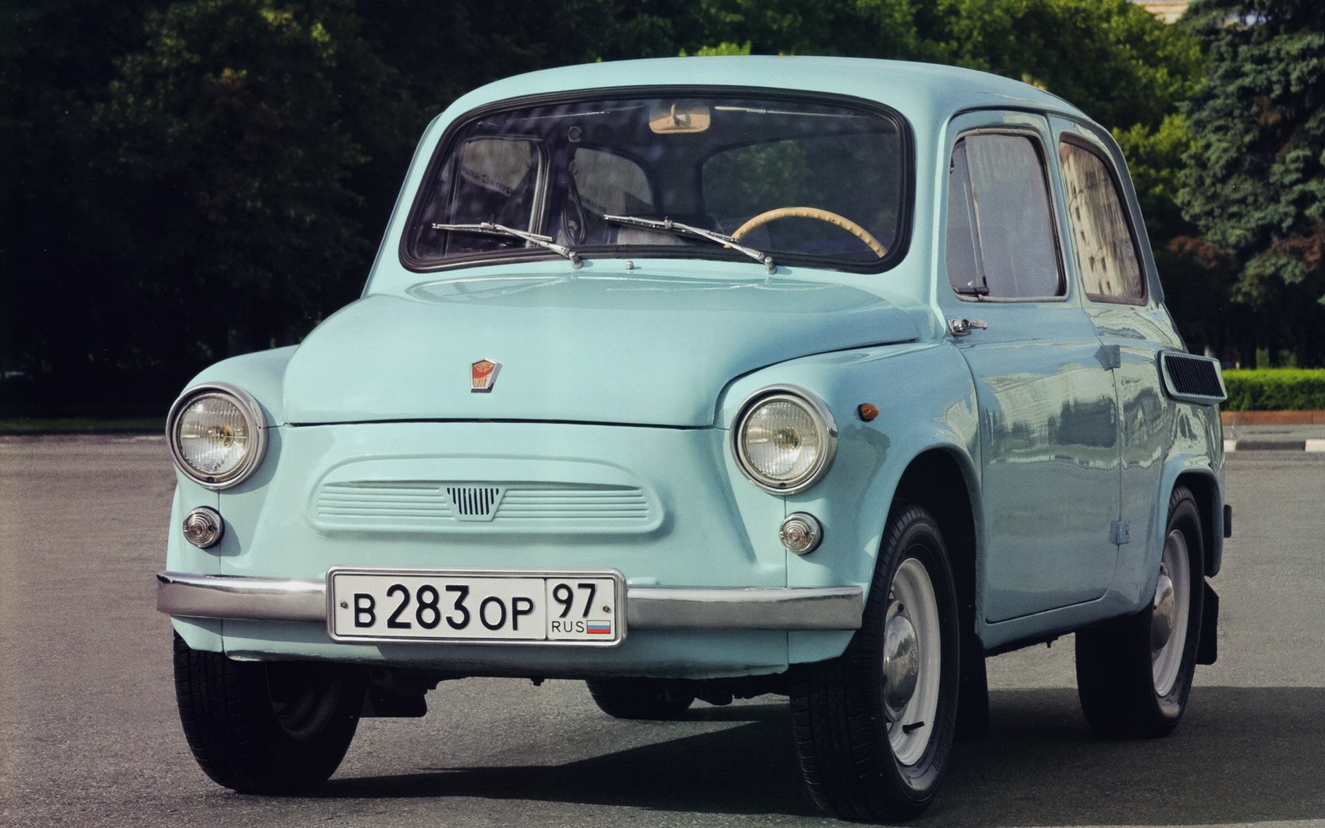 Light blue retro Russian car parked on asphalt HD Wallpaper