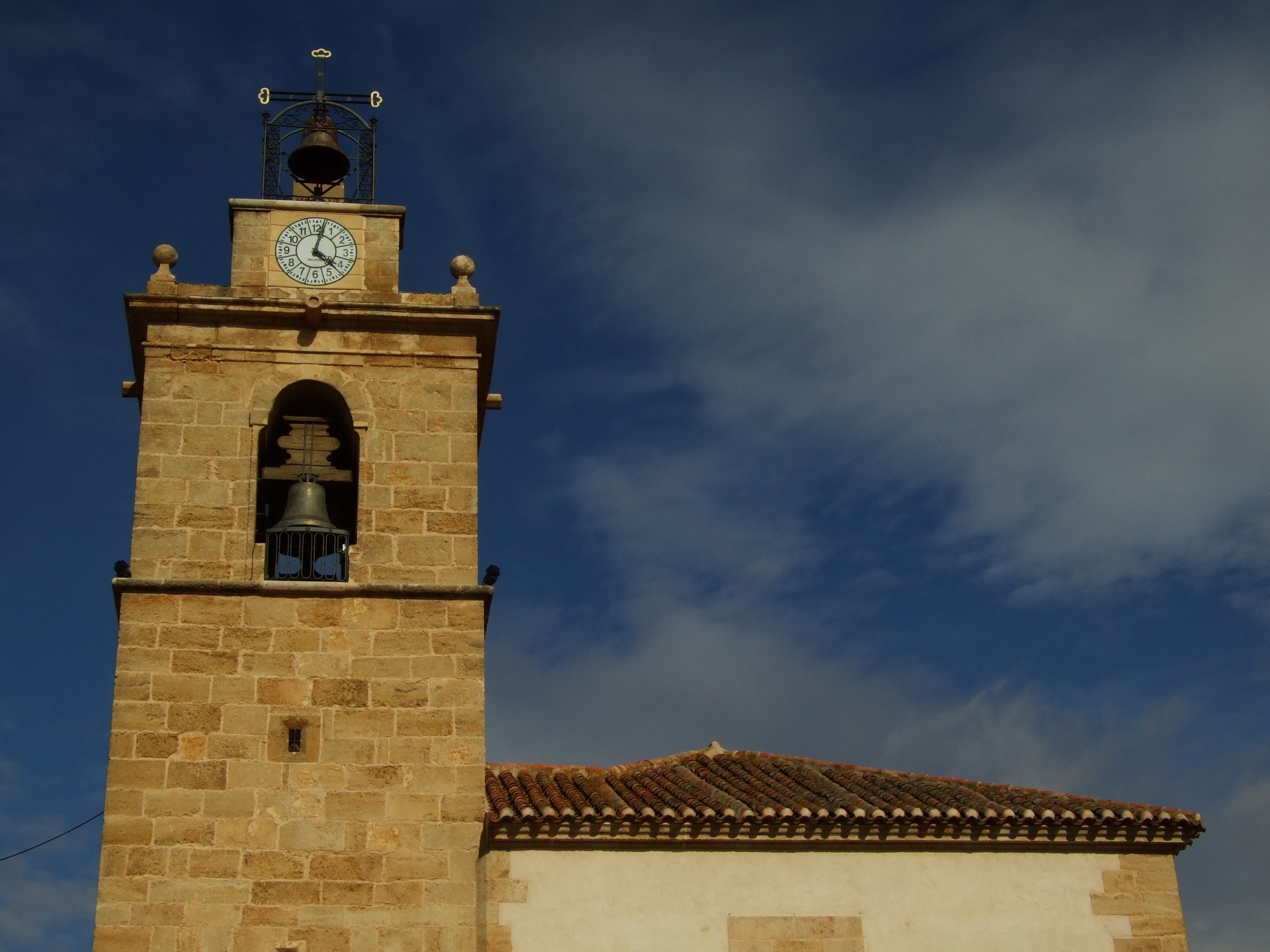 Bell tower with clock and bells in Tomelloso, Spain HD Wallpaper