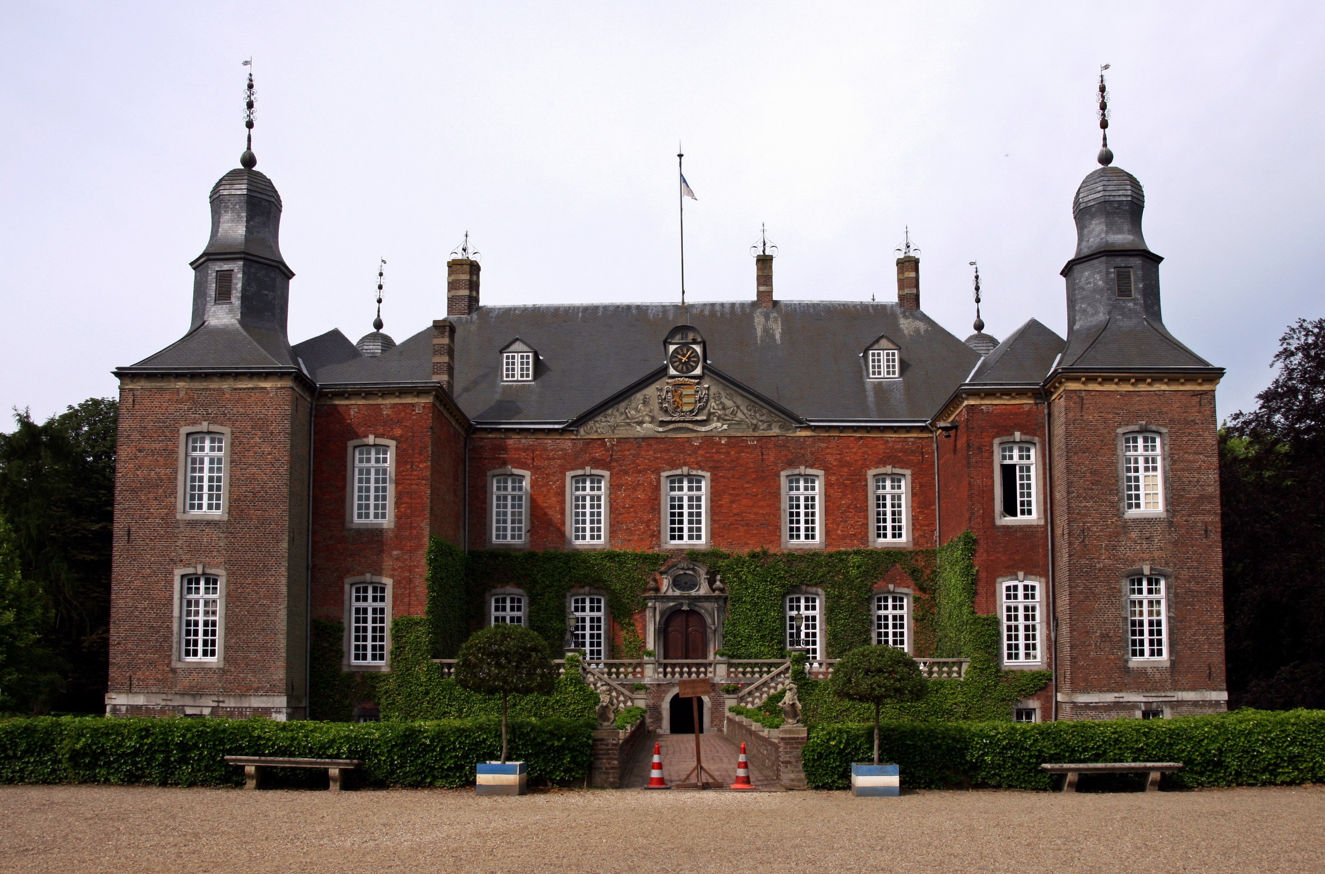 Castle with red brick facade and two towers HD Wallpaper