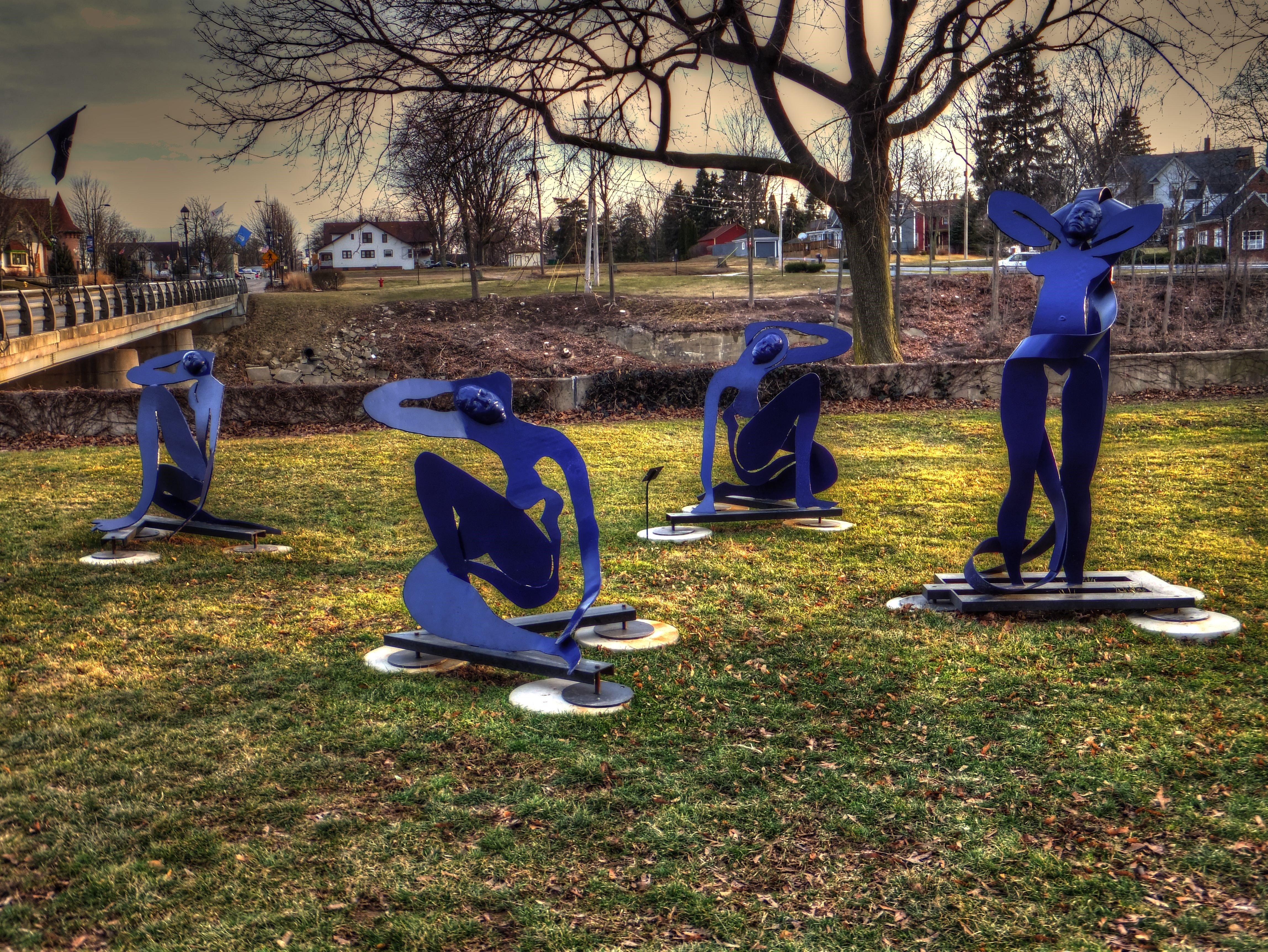 Four Blue Sculptures in a Park HD Wallpaper