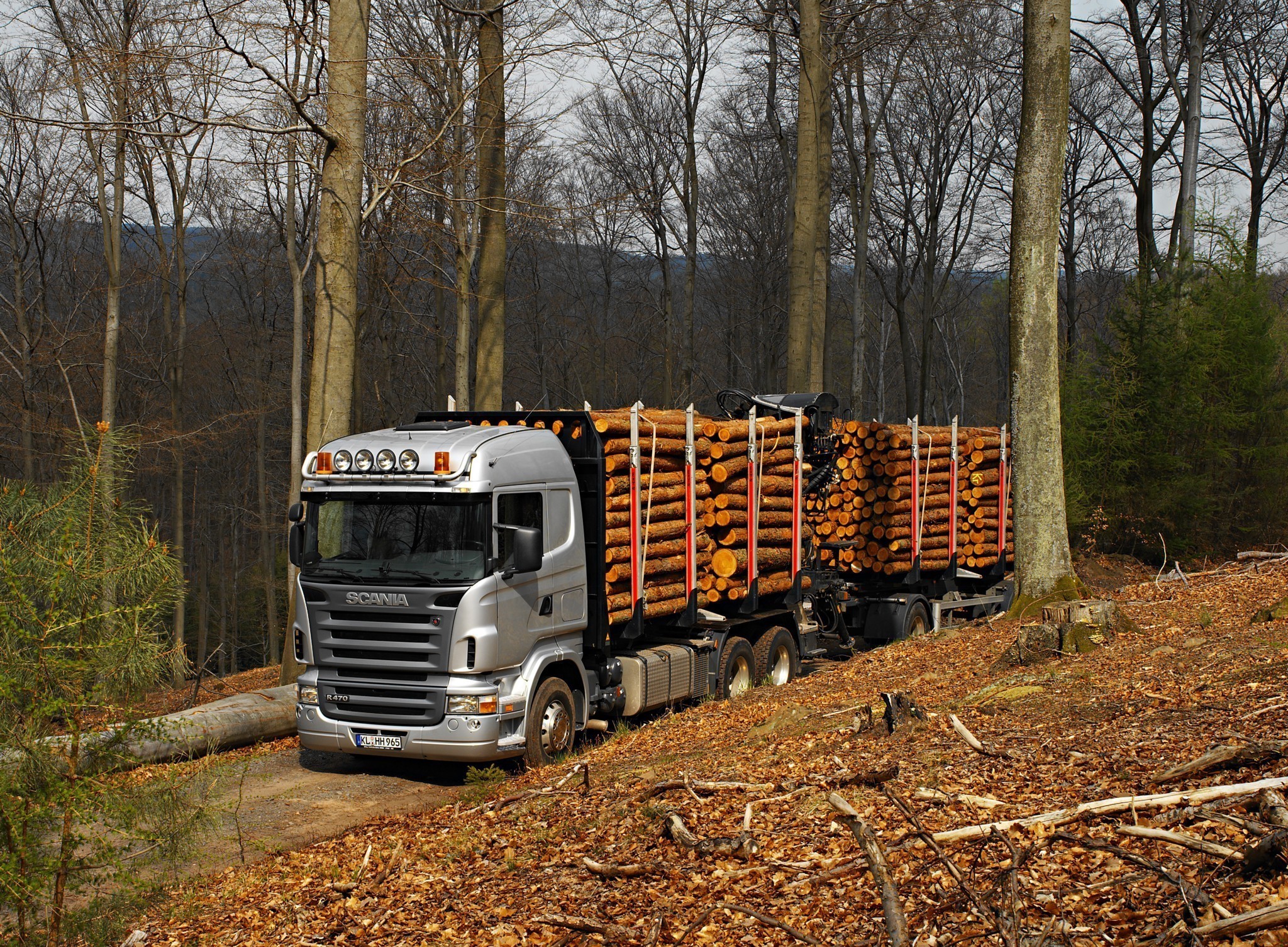 Scania logging truck in a forest HD Wallpaper