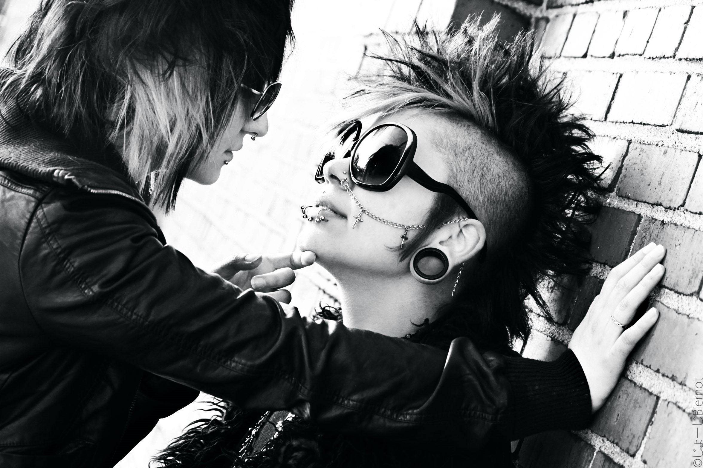 Two people with piercings and sunglasses HD Wallpaper