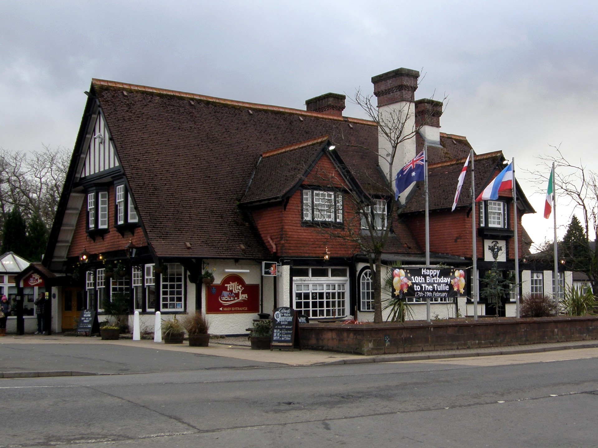 The Tullie Inn pub with flags and birthday banner HD Wallpaper