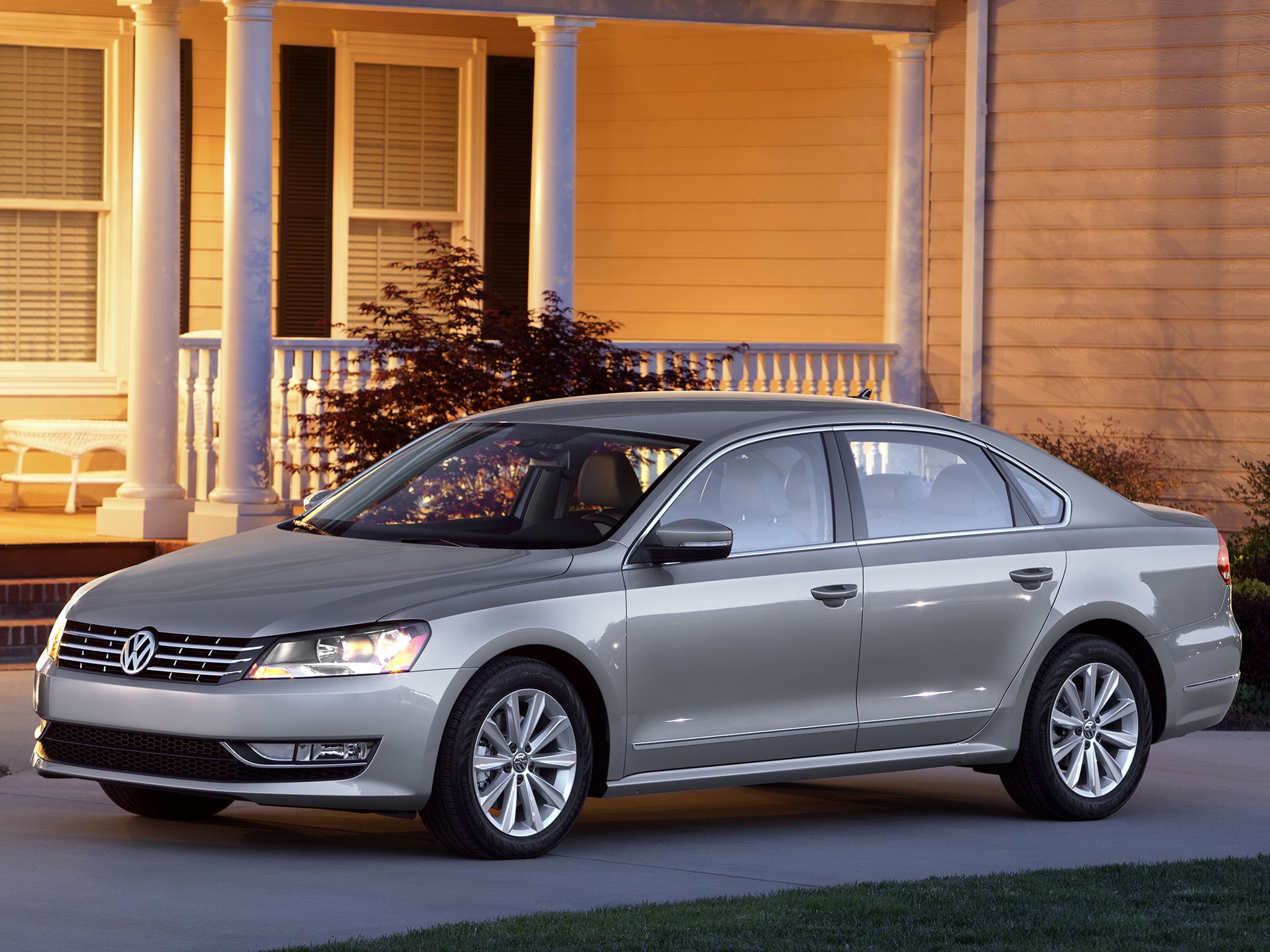 Silver Volkswagen Sedan parked in front of a house HD Wallpaper