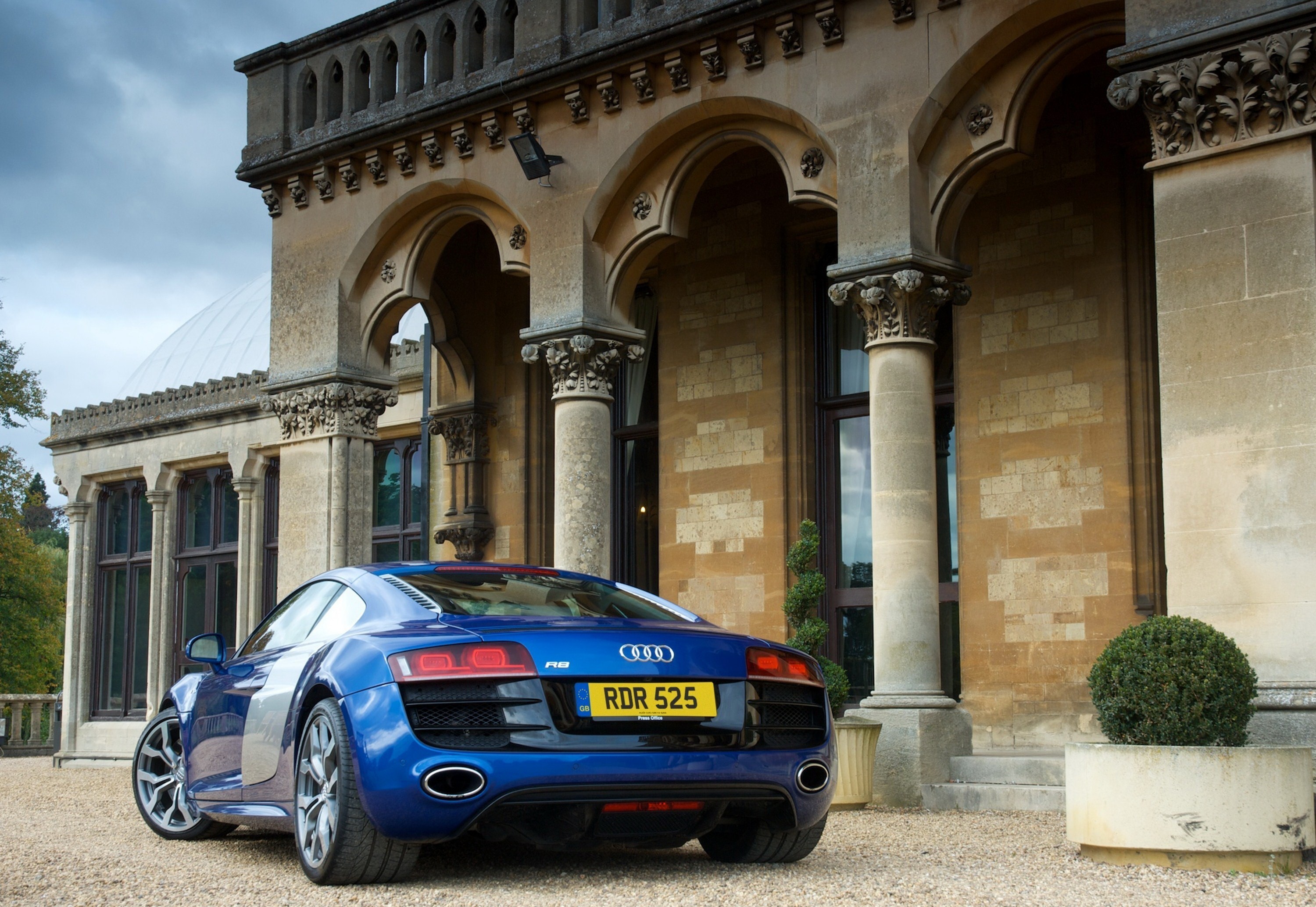 Blue Audi R8 parked in front of a stone building HD Wallpaper