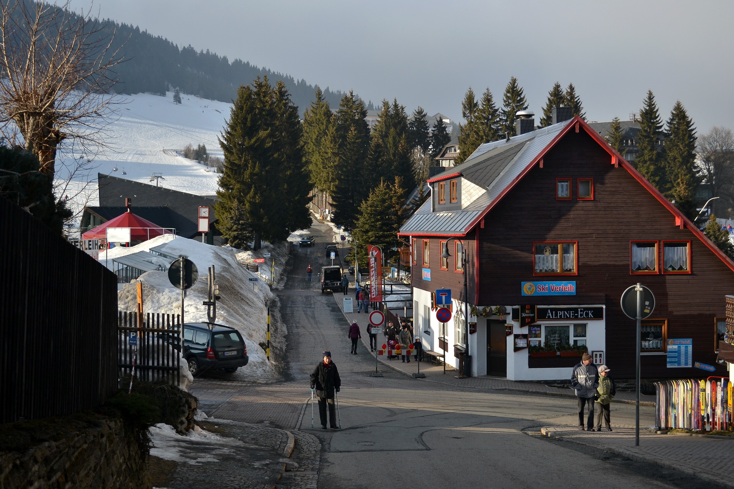 Village street with ski slope in Germany HD Wallpaper