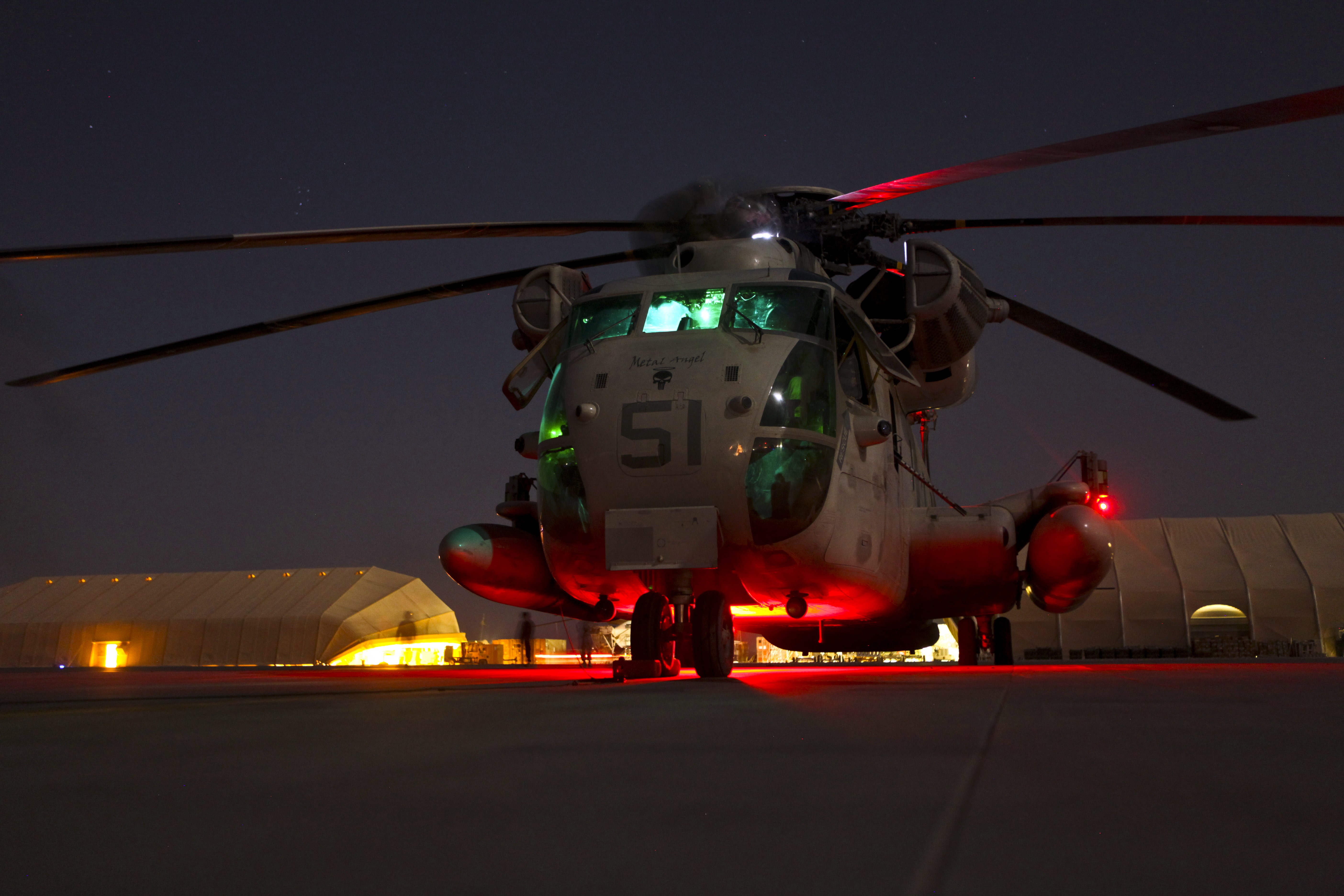 Helicopter 51 on tarmac at night HD Wallpaper
