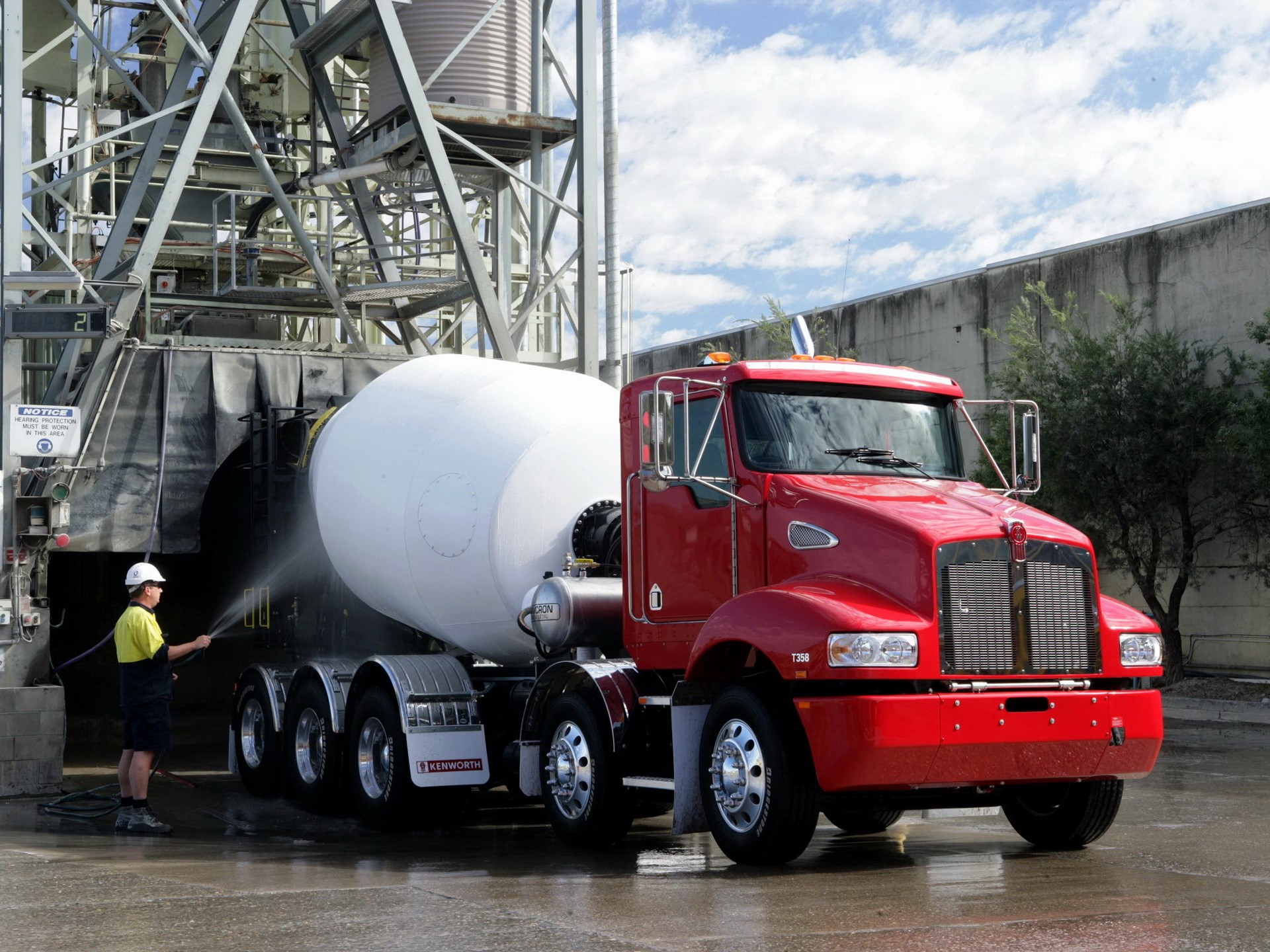 Red Kenworth cement mixer truck being washed HD Wallpaper