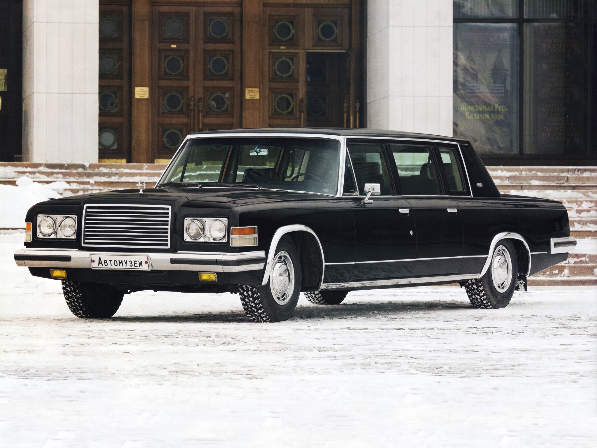 Black Zil limousine parked in front of a building HD Wallpaper