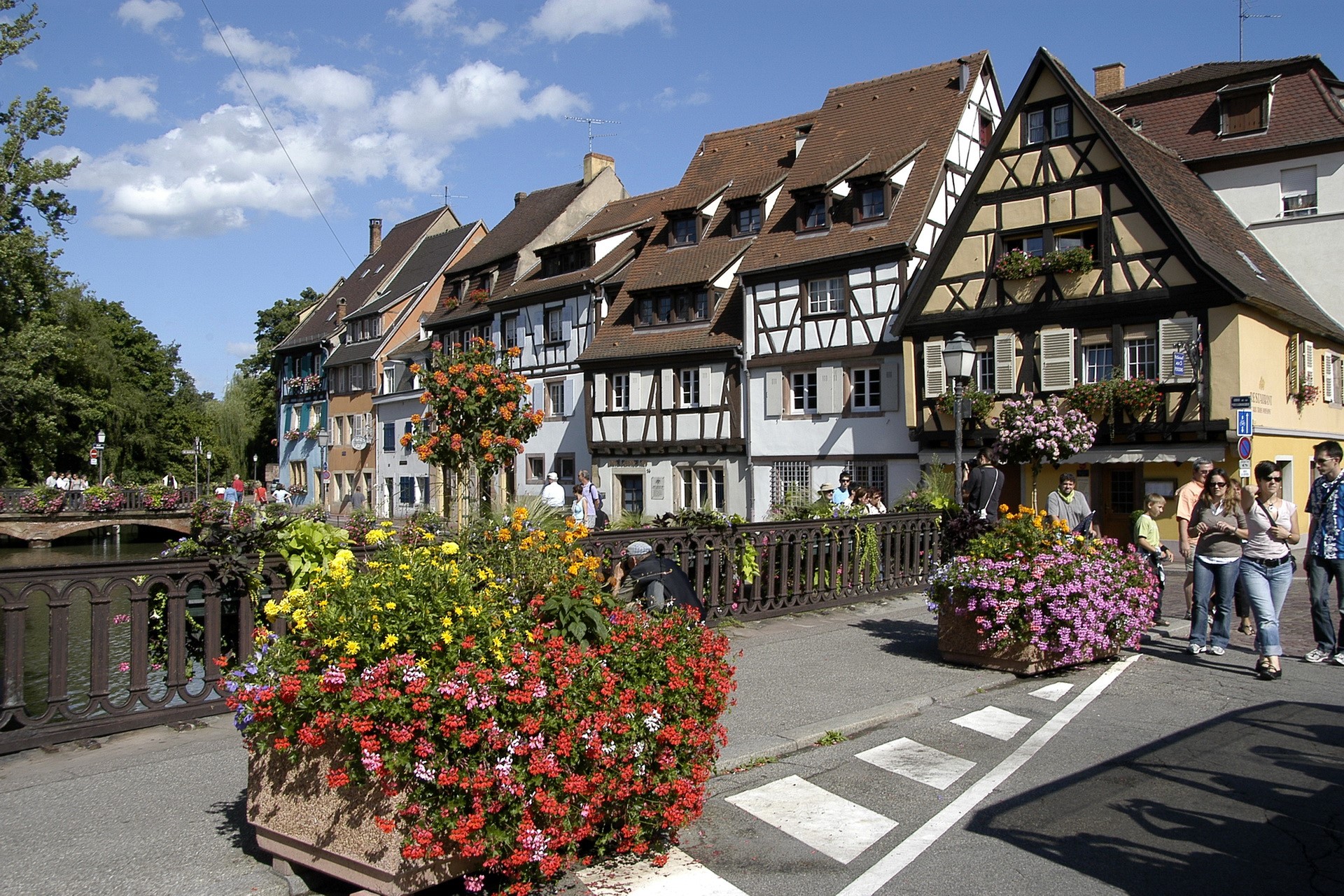 Half-timbered houses along a canal in France HD Wallpaper