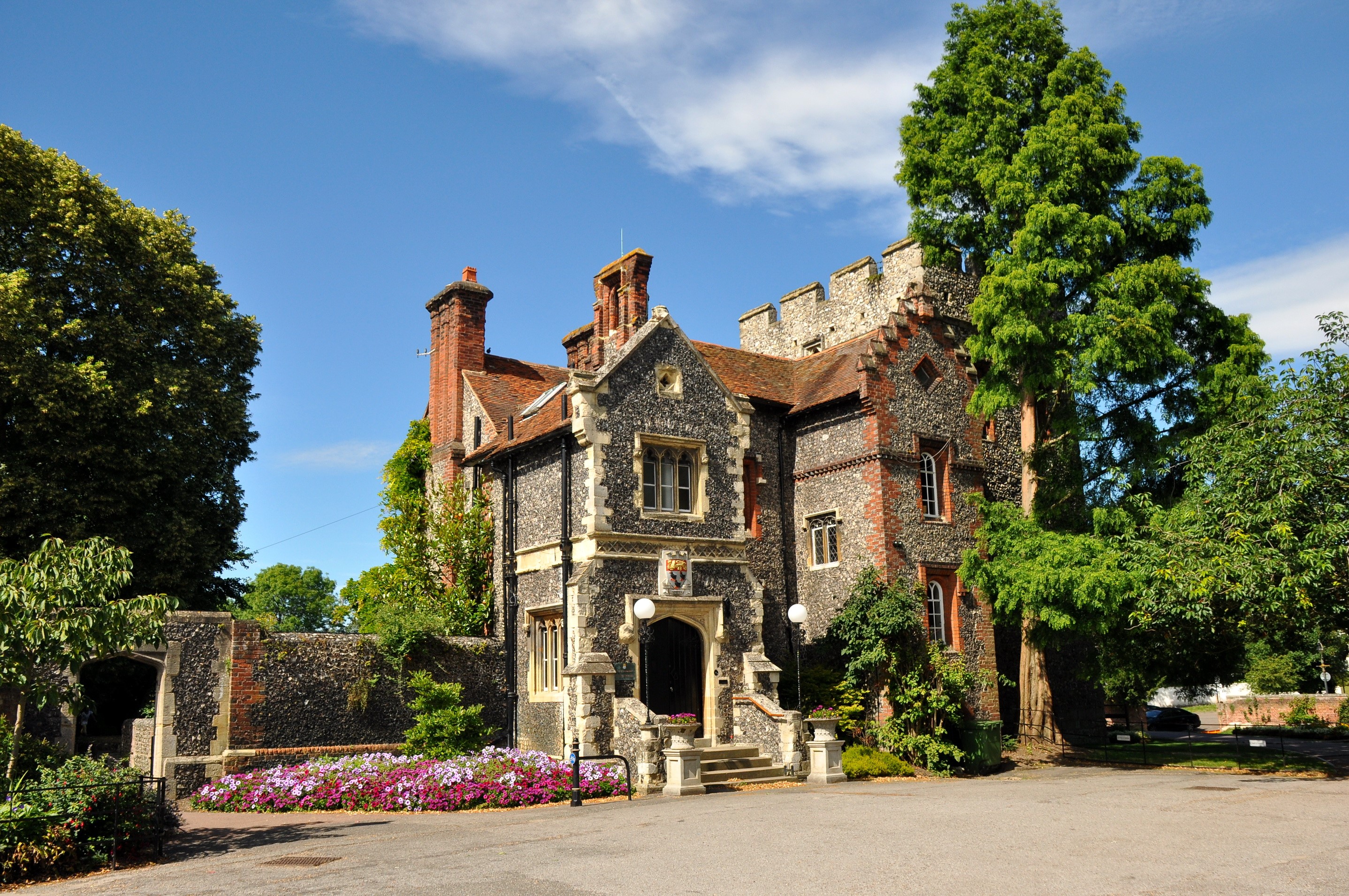 Stone and brick house with crenellated tower in the UK HD Wallpaper
