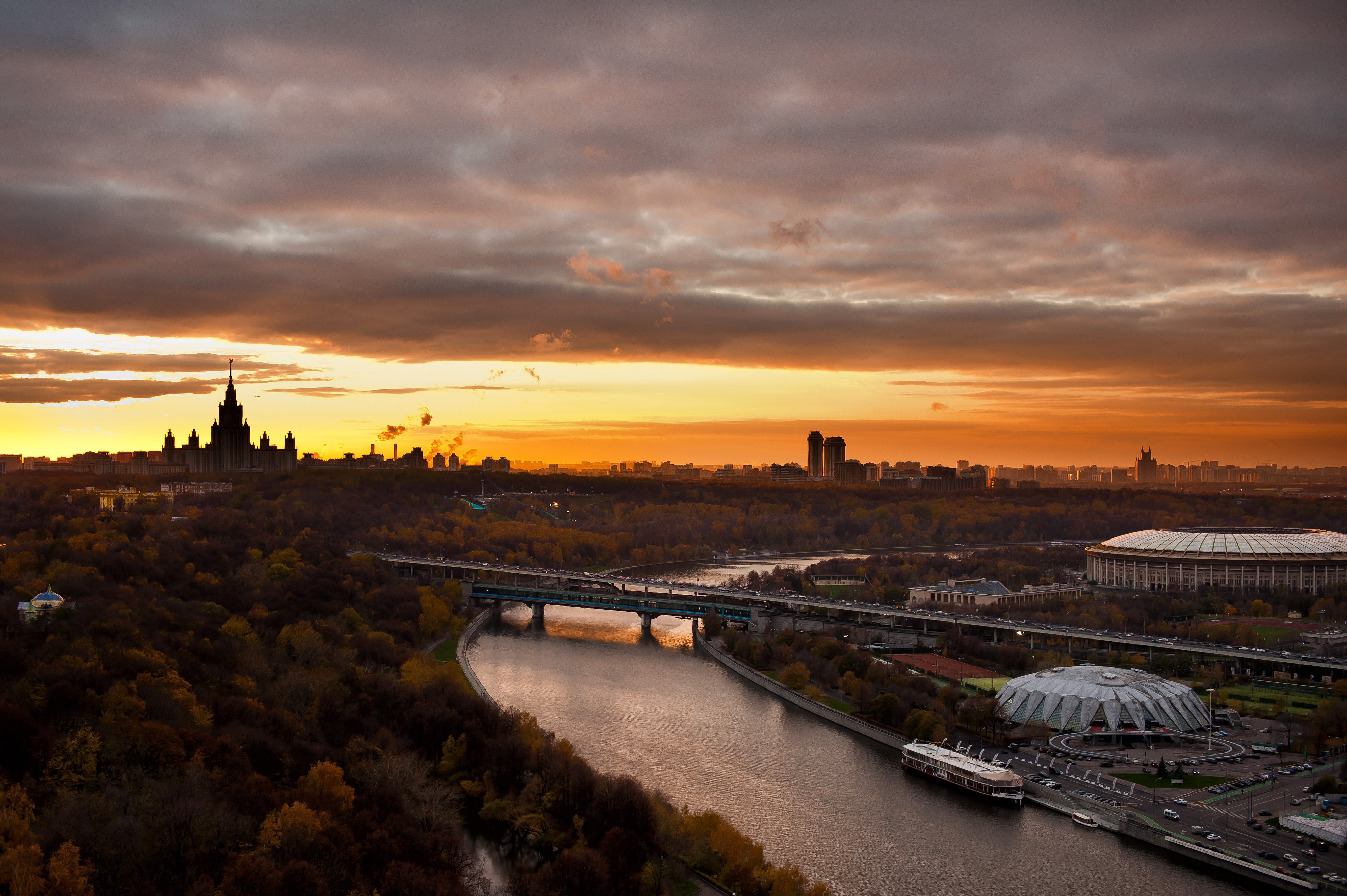Moscow cityscape at sunset with river and stadium HD Wallpaper