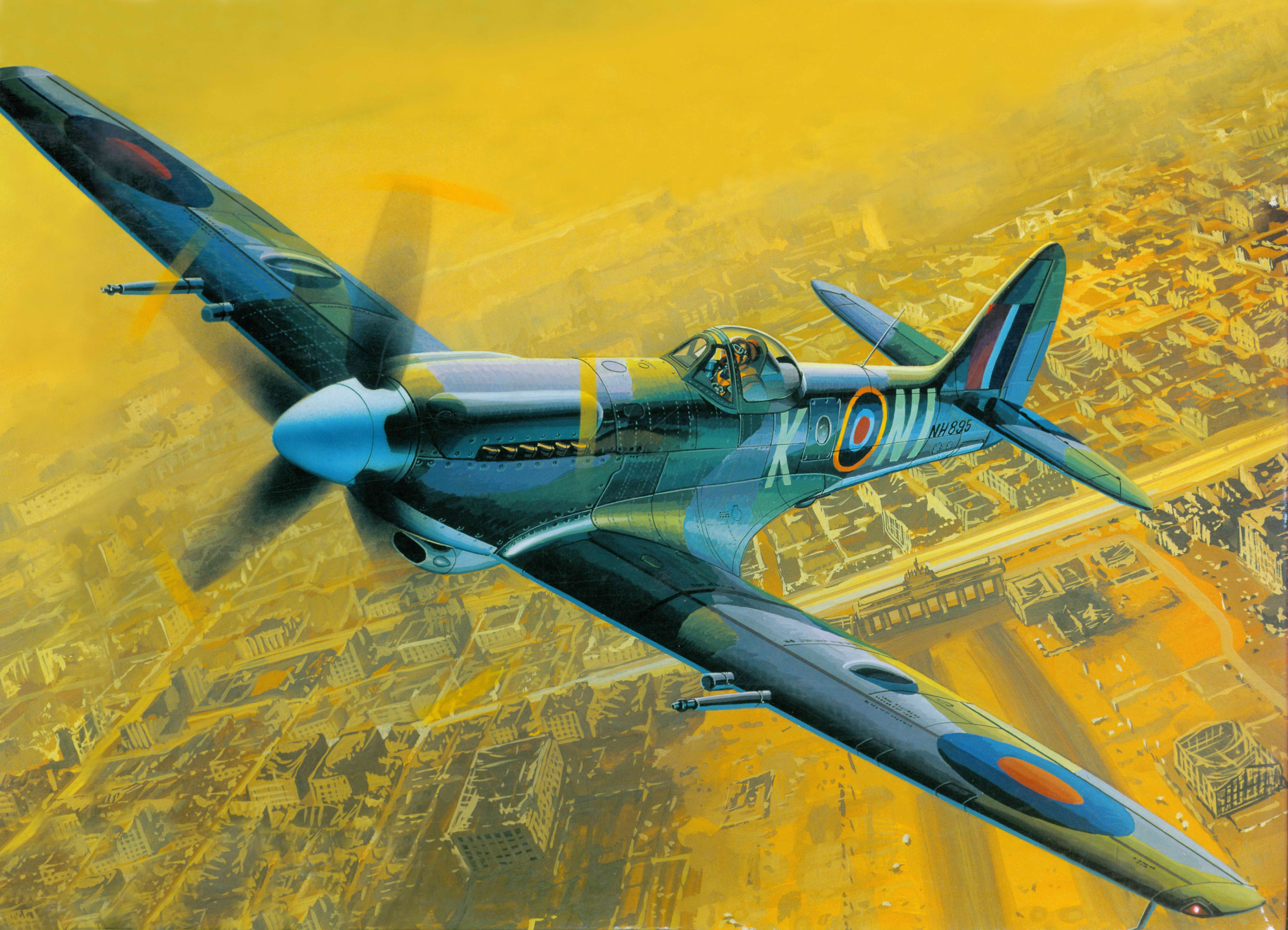 Supermarine Spitfire airplane flying over city HD Wallpaper