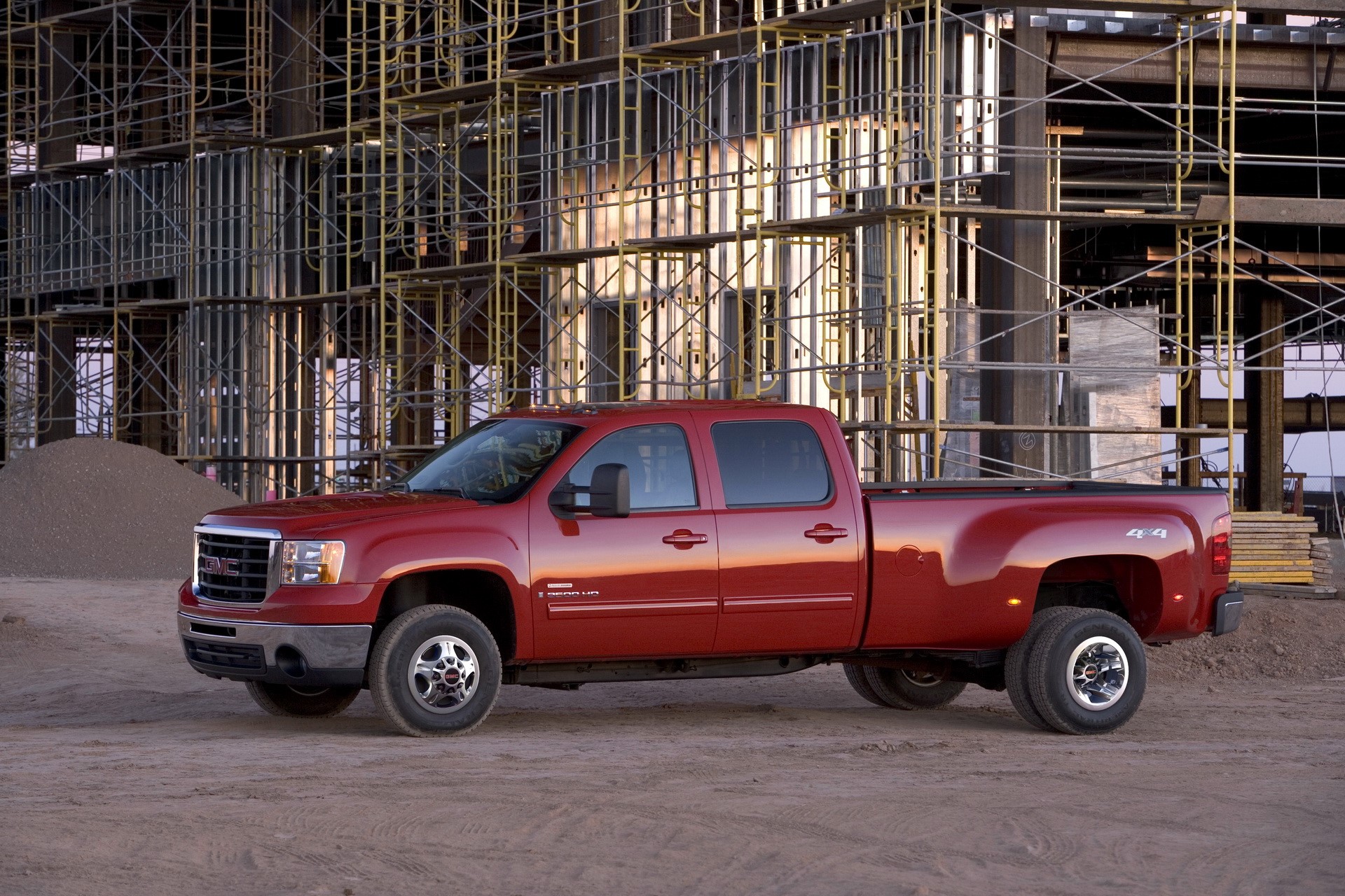 Red GMC Sierra 3500 HD Dually Truck at Construction Site HD Wallpaper