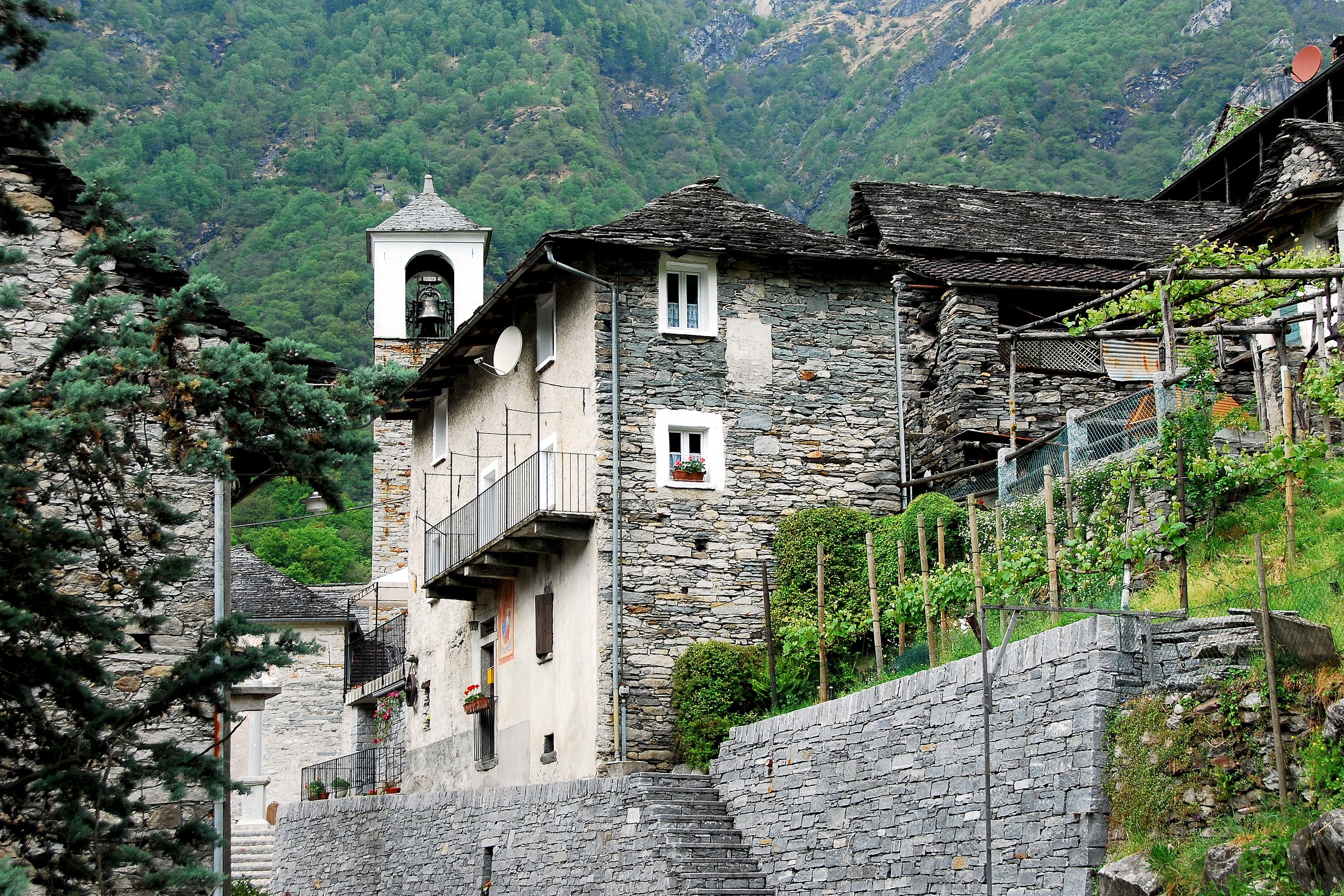 Stone houses and bell tower in Vogorno, Ticino, Switzerland HD Wallpaper