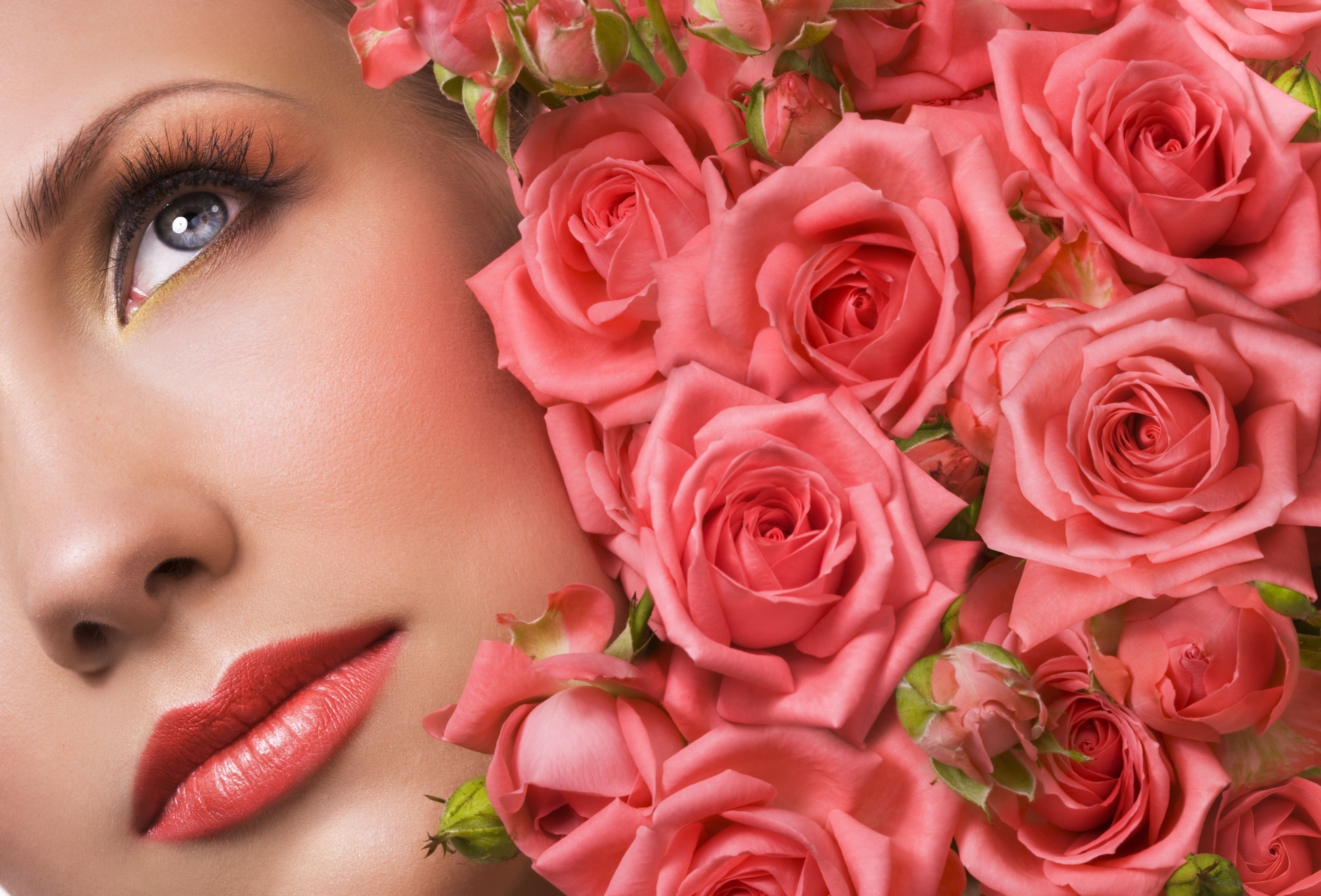 Close-up of a woman's face with pink roses HD Wallpaper